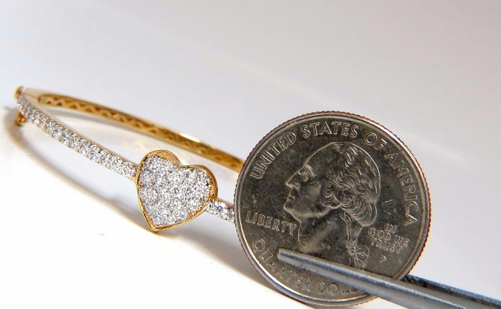 Heart Bangle.

1.30ct. Natural diamonds bangle bracelet.

Bead set, smooth & clean finish.

Round, Full cuts, 

G color

Vs-2 clarity.

14kt. yellow gold 

7.6 Grams.

10mm wide at heart.

Made for 7 inch wrist

safety clasp/ snap lock

$6000