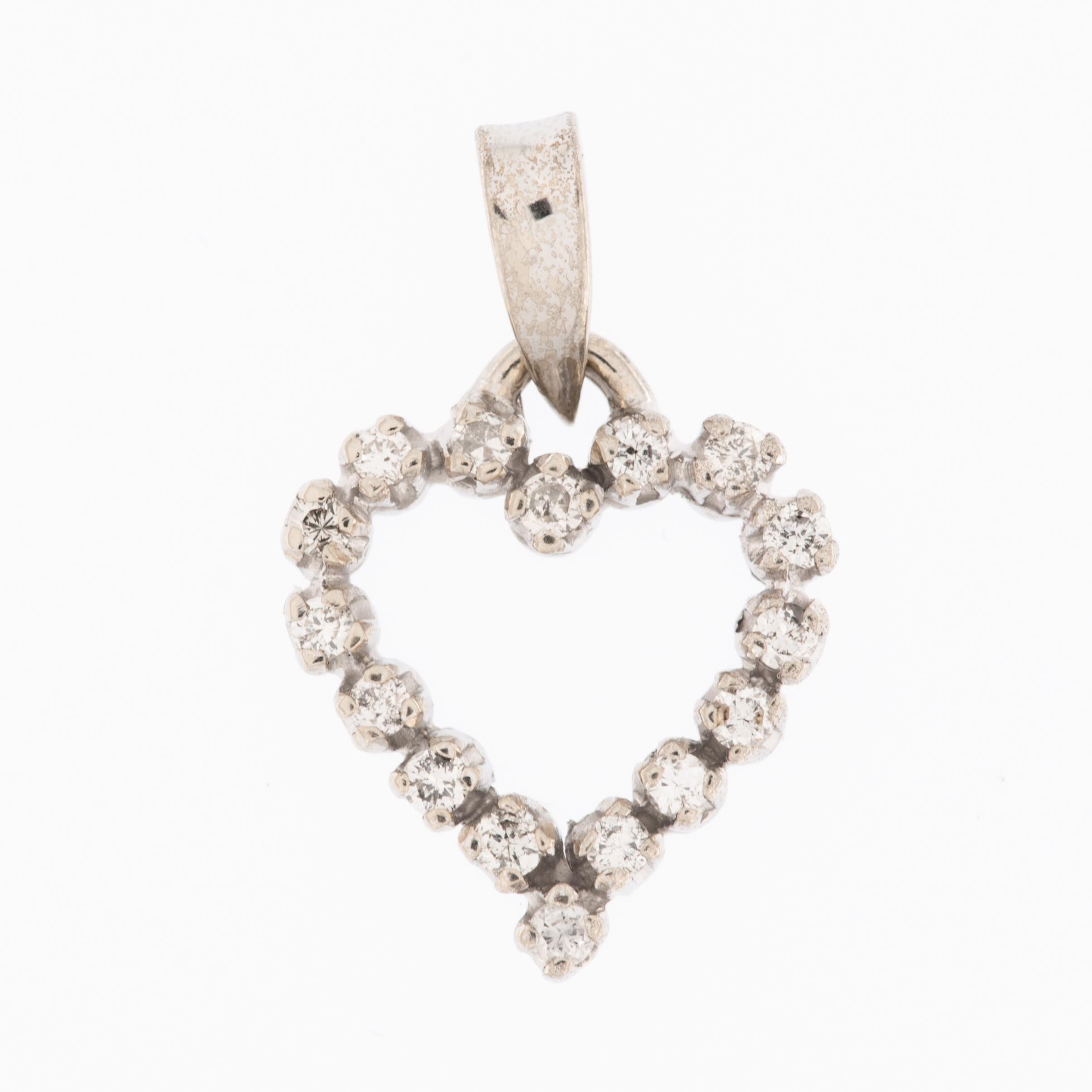 This stunning Diamonds Heart Pendant is a testament to both sophistication and timeless elegance. Crafted from luxurious 18 karat white gold, the pendant showcases a flawless combination of purity and opulence. The white gold provides a sleek and