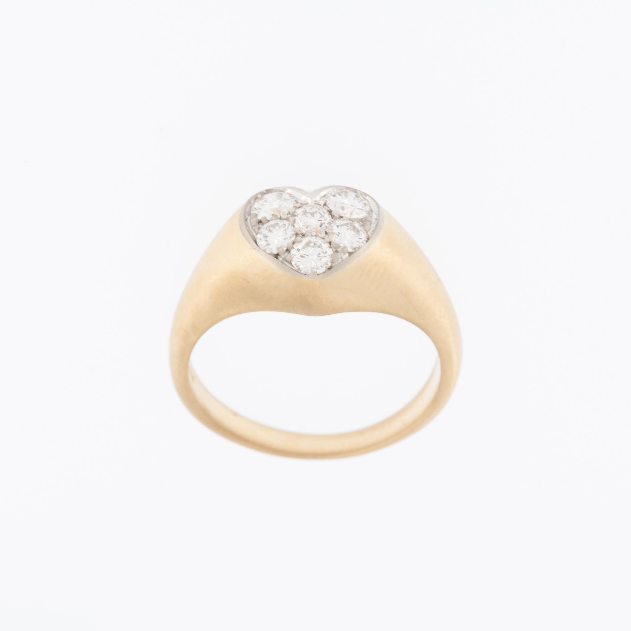 This exquisite piece of jewelry combines the timeless elegance of diamonds with the warm allure of 18 karat gold, culminating in a design that exudes both luxury and sentimentality. 

Crafted from 18 karat yellow and white gold, this ring offers a
