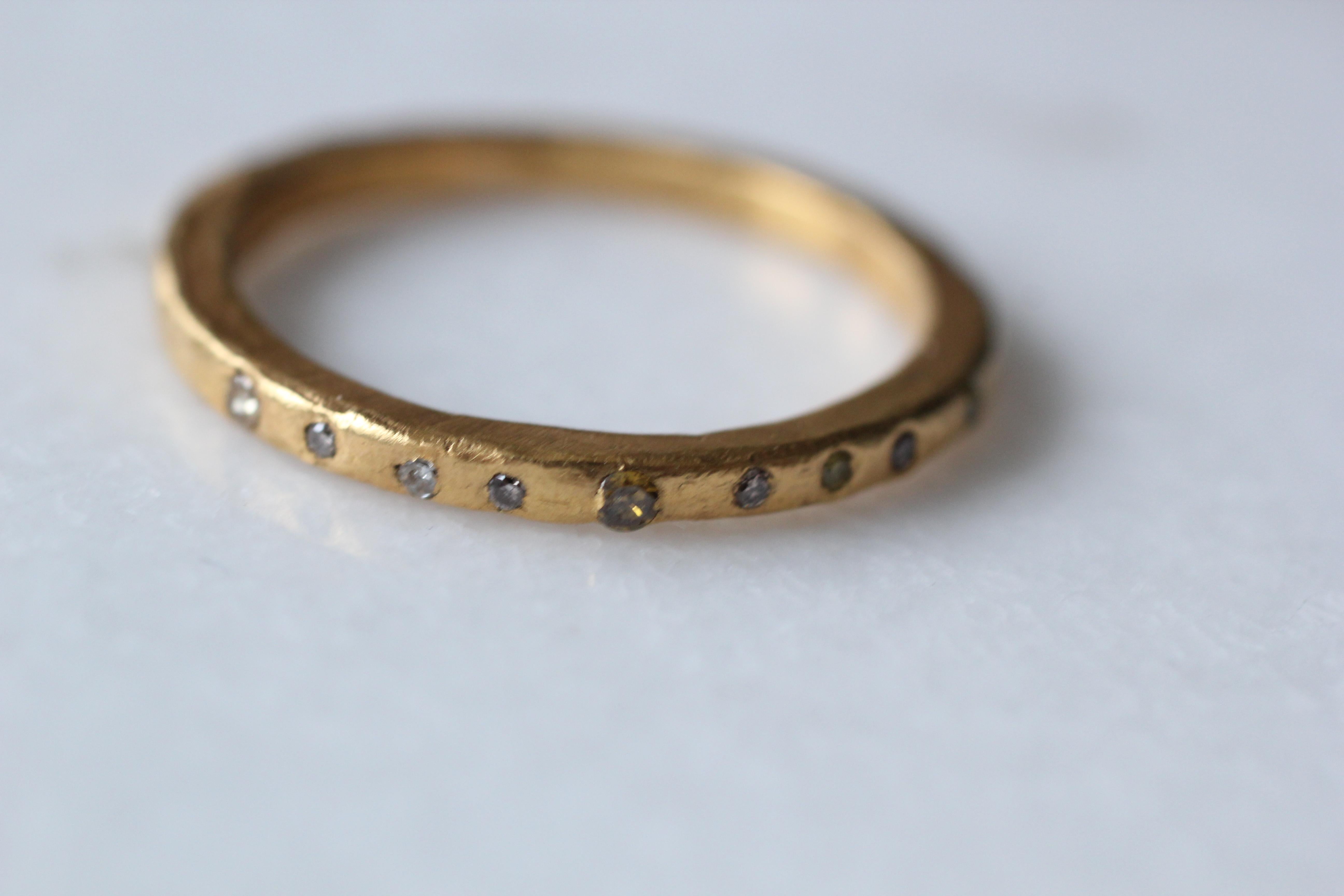 A handmade bridal or fashion ring in a 21k gold set with 9 colored diamonds. Simplicity Small Band contemporary unisex design with 9 diamonds. Wear it alone or stacked combining it with our other AB Jewelry NYC ring designs to create a unique and