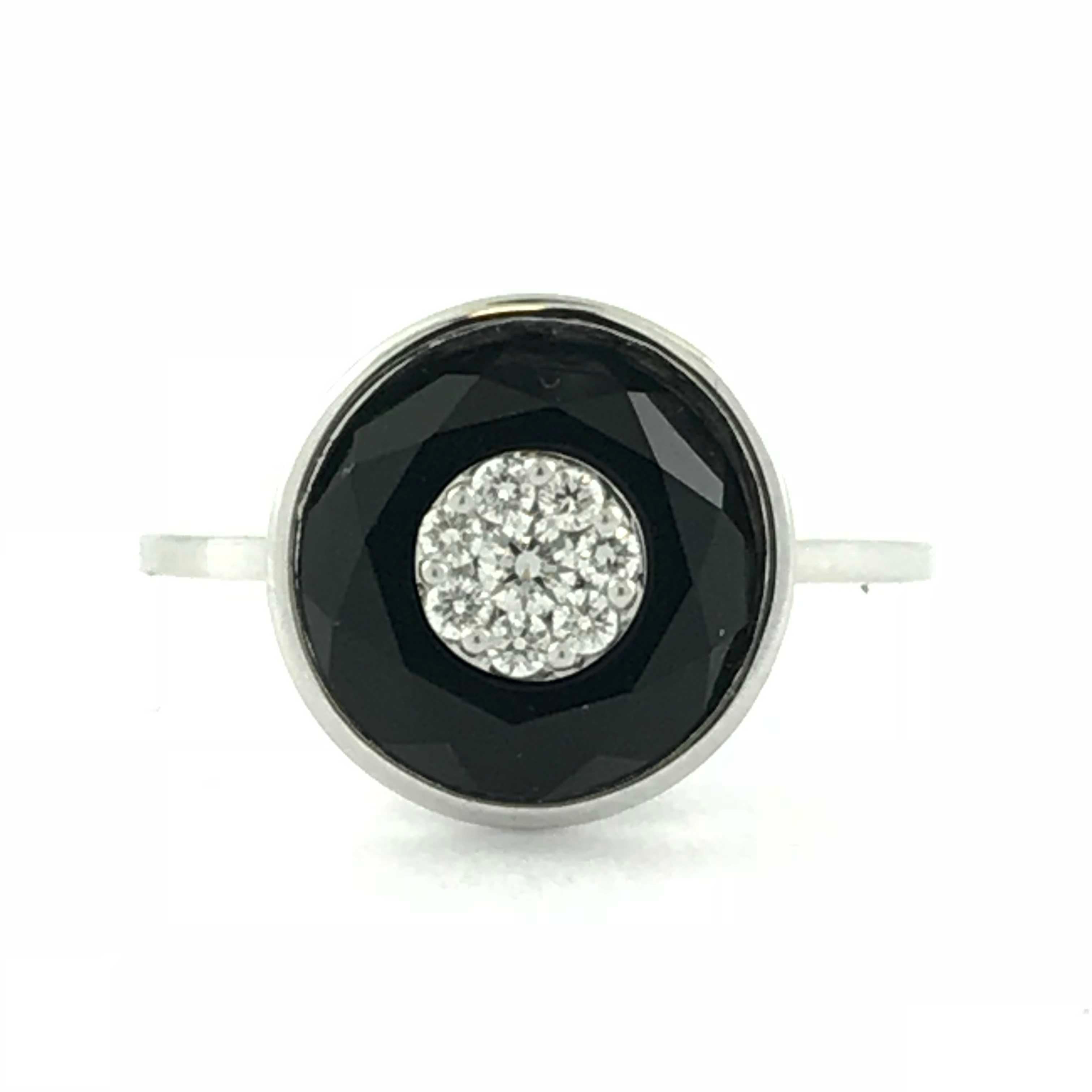 From our signature Bhansali One collection, this ring features clusters of G,VS diamonds (0.12 ct ) inlaid into special cut onyx ( 2.70cts ) and set in 18kt gold.  Bhansali ONE dresses up jeans as well as it sparkles up gowns. It is the the perfect