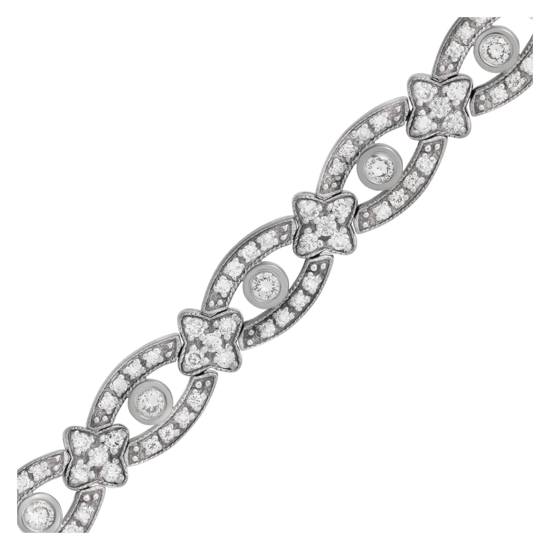 Diamond line bracelet set in 14k white gold. Round brilliant cut diamonds total weight approximately 3 carats, estimate: G-H color, VS-SI clarity. Width: 0.25 inch. Length: 6 3/4