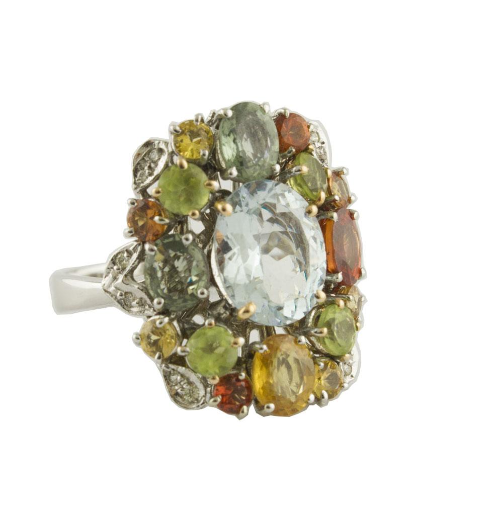 Unique ring in 14K white gold mounted with fabulous aquamarine in the center and studded by diamonds leaves peridots and multi-color sapphires around
Diamonds 0.08
Multi-color Sapphires 1.48 ct 
Peridots and Aquamarine 4.69 ct 
Total weight 7.70