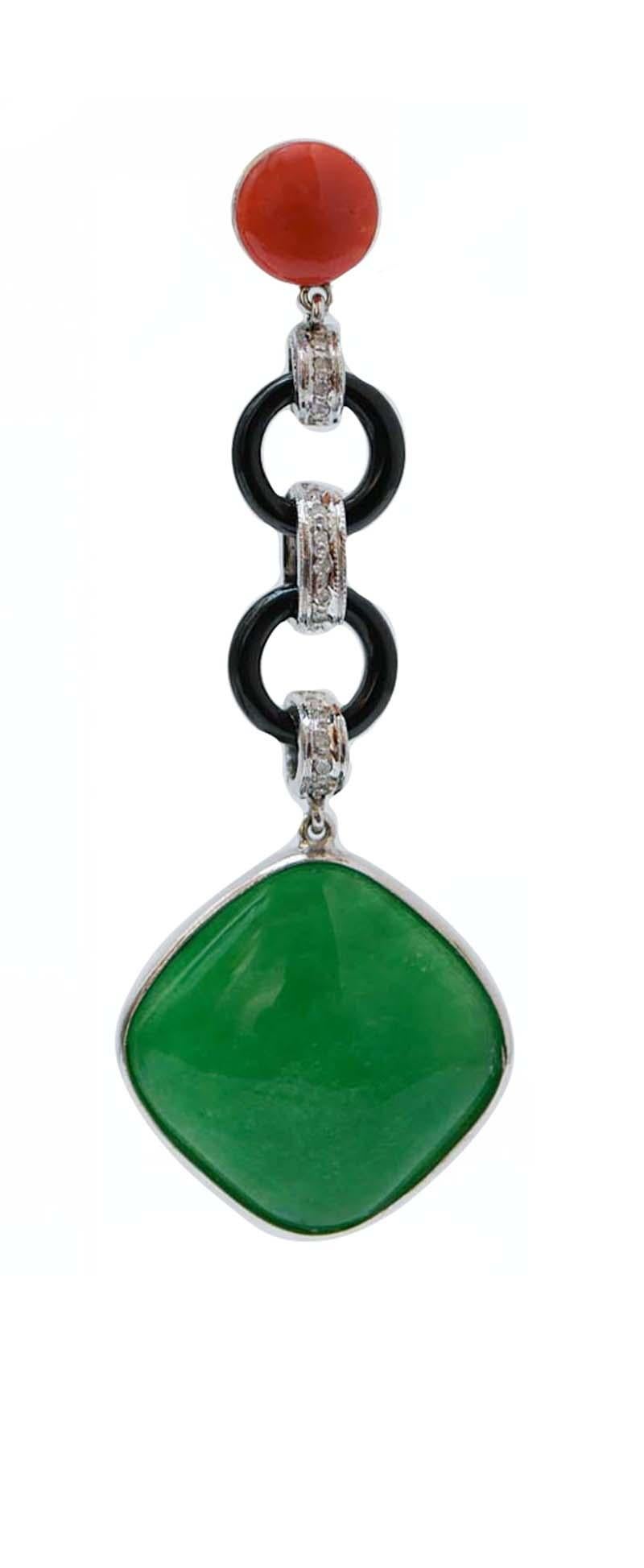 Fantastic earrings in platinum structure mounted with a coral in the upper part; in the middle, onyx rings linked by structures studded with diamonds and, as pendant, a jade.
These earrings were totally handmade by Italian master goldsmiths and they
