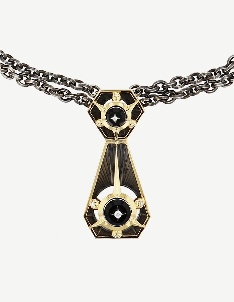 Diamonds Onyx Triangle Necklace in 18k yellow gold by Elie Top. Tie necklace in distressed silver and 18K yellow gold. Rotating sphere opening on an onyx disc, revealing a star set with a diamond.
