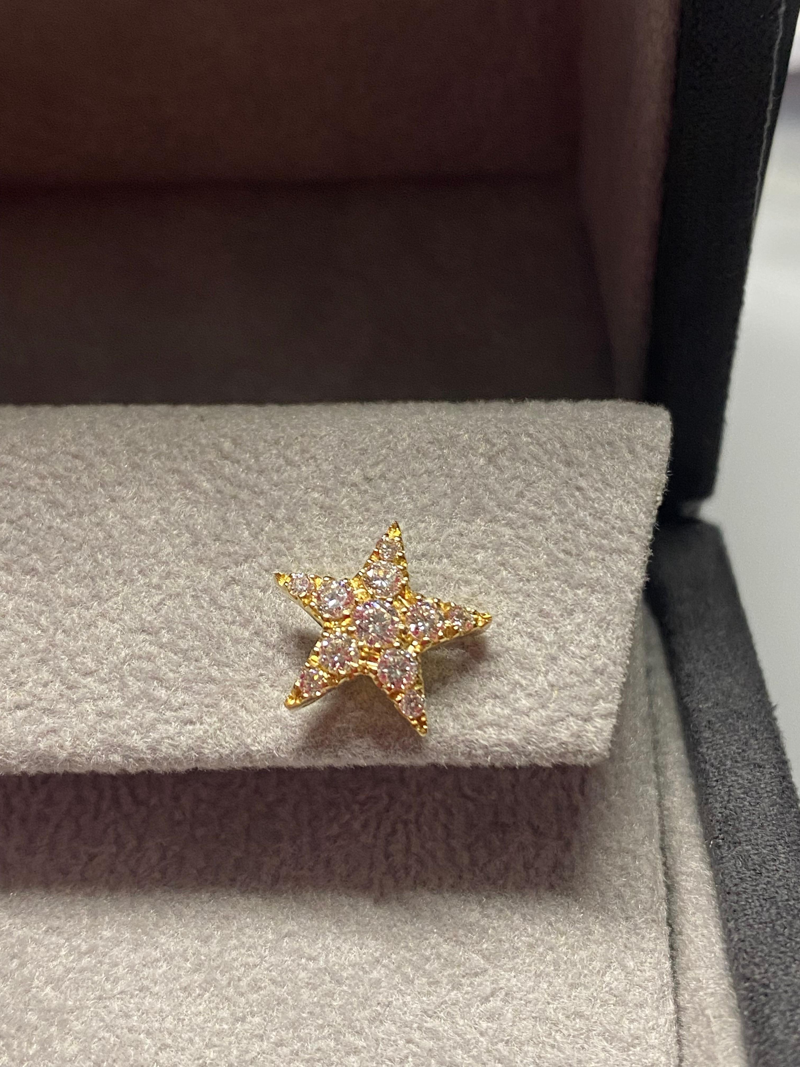 Beautifully pavé set in diamonds, the single Star lobe earring is handcrafted in Italy, in Margherita Burgener workshop. Very sparkling and very chic.
SINGLE STAR - in the pictures you can see also the single one in white gold.
Size inches 0,472  at
