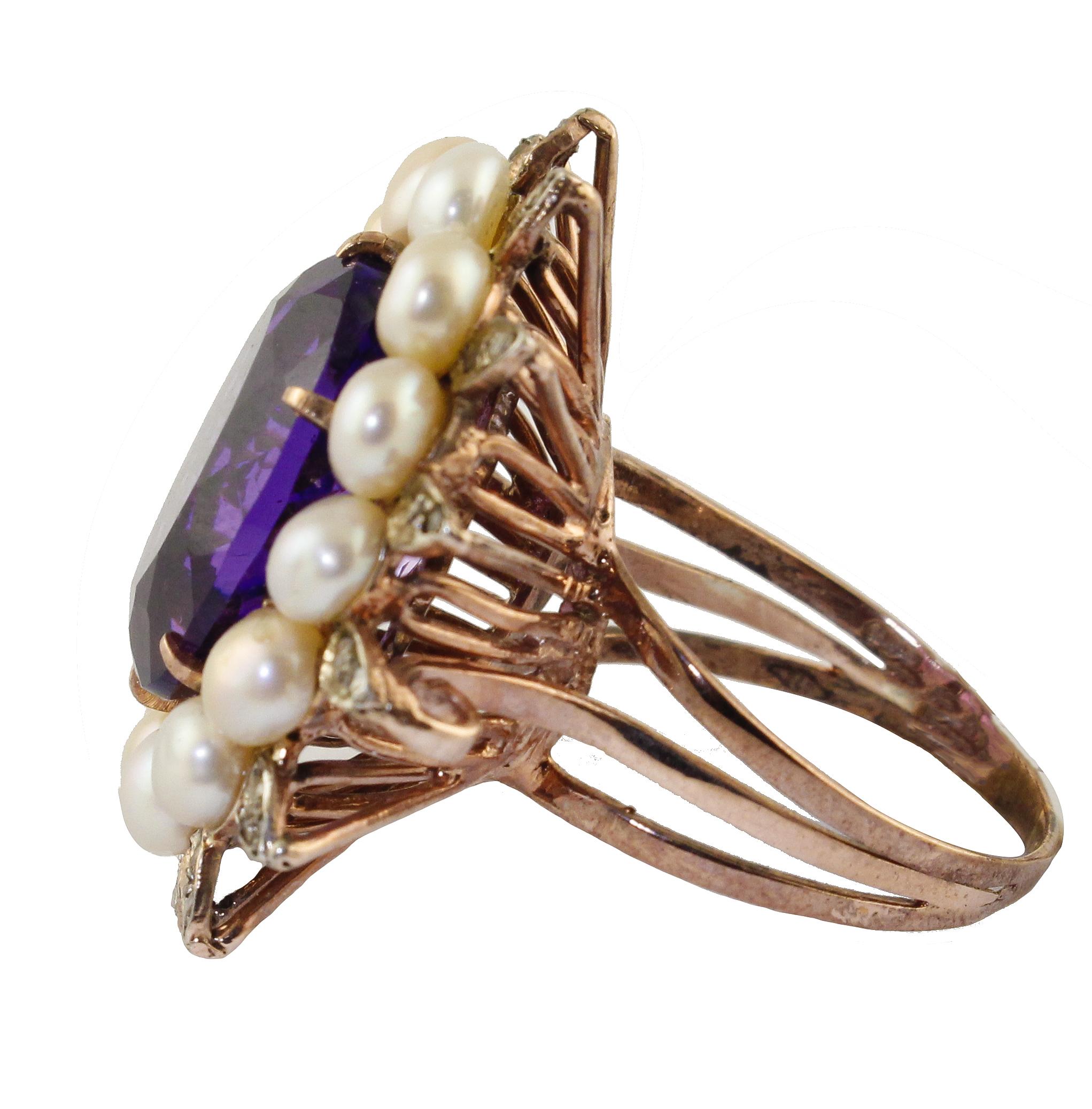 Wonderful ring in 9k rose gold structure composed by an amazing amethyst in the center surrounded by pearls crown and silver leaves studded by diamonds.
Diamonds 0.13 ct 
Pearls 1.00 g
Amethyst 1.70 g
Total weight 9.20 g
R.F * arfe
Dimentions of