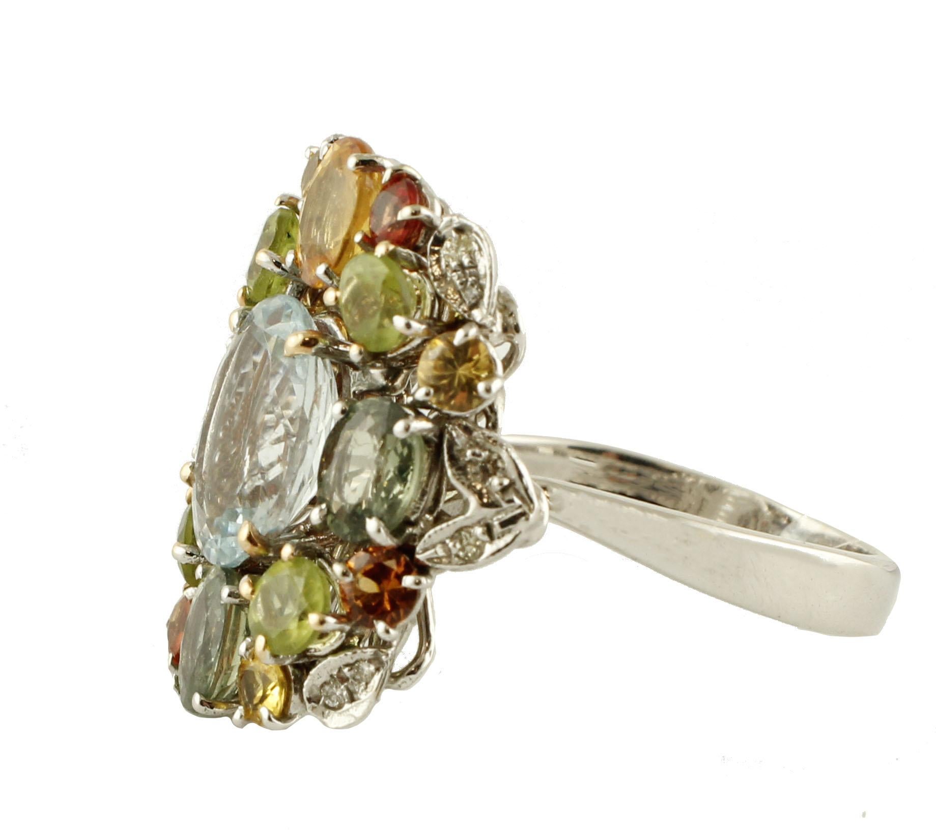 
Fabulous 14 kt white gold ring, embellished with 0.08 ct diamonds, fantastic colored sapphires, peridots and central aquamarine all of ct 6.17

Precious stones in color ct 6.17
Diamonds ct 0.08
Size ita. 16:50
Size franc. 56.50
Size USA. 7.75
Total