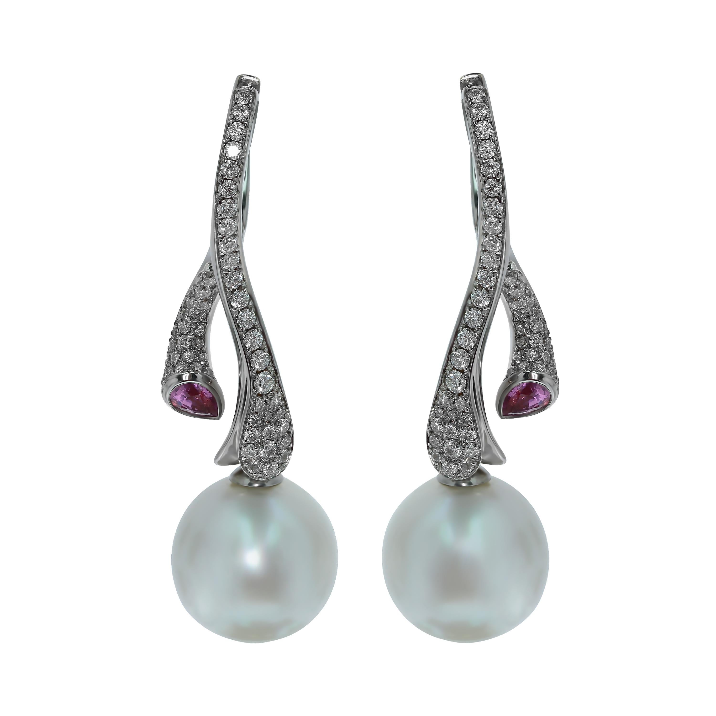 Diamonds Pink Sapphire South Sea Pearl  18 Karat White Gold Earrings
Earrings are made in water theme. 108 Diamonds totaling 1.13 Carat on the White 18K Gold remind the sea foam that escorts us to the bottom of the ocean to two incredible South Sea