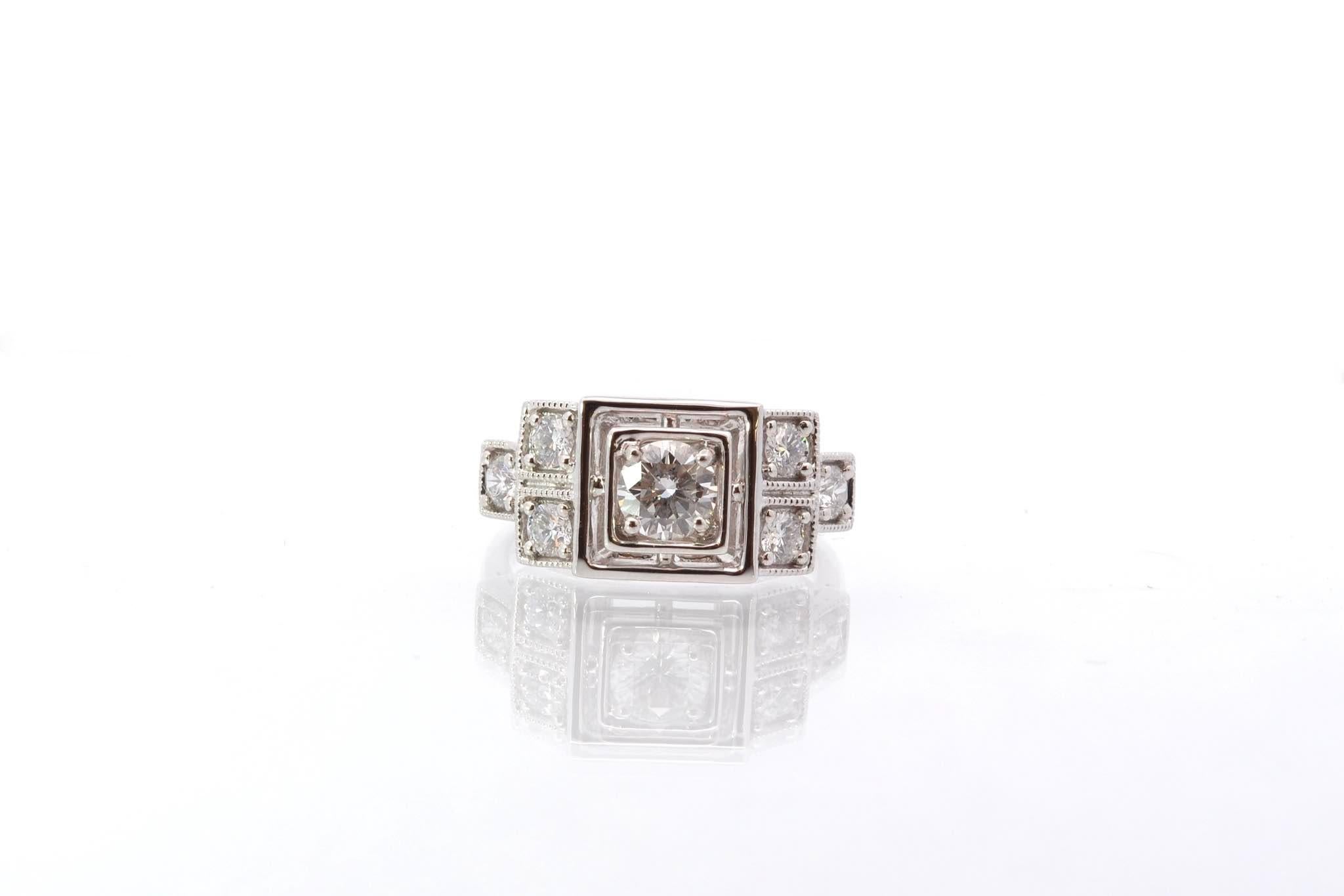 Stones: Central diamond: 0.54 ct, 6 diamonds: 0.52 ct
Material: 18k white gold
Dimensions: 1cm
Weight: 6.4g
Period: Recent vintage art deco style
Size: 54 (free sizing)
Certificate
Ref. : 25570 25559