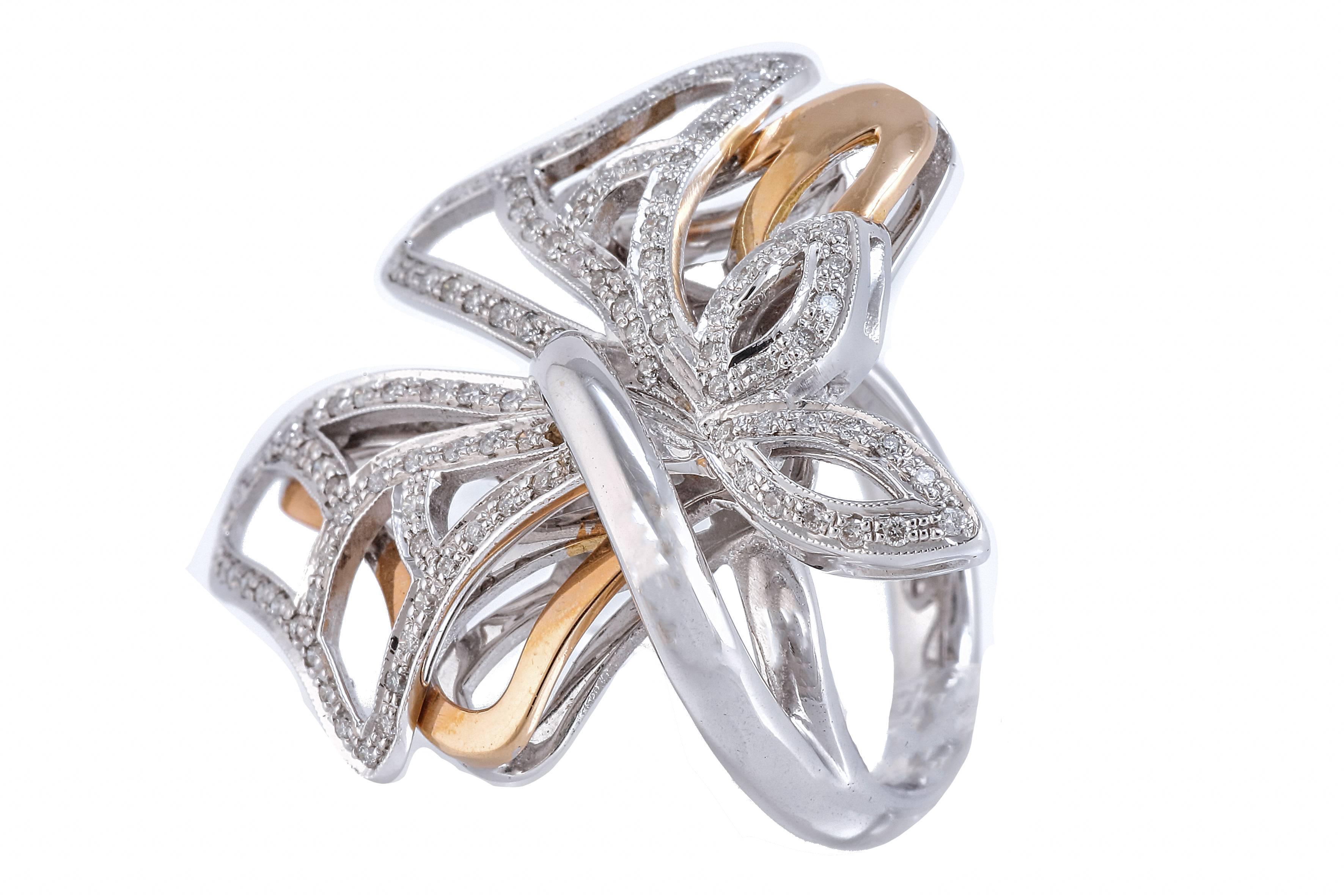 shipping policy: 
No additional costs will be added to this order.
Shipping costs will be totally covered by the seller (customs duties included). 
 

Very elegant ring in 18 kt white and rose gold, with a designe in the shape of two bows, the one