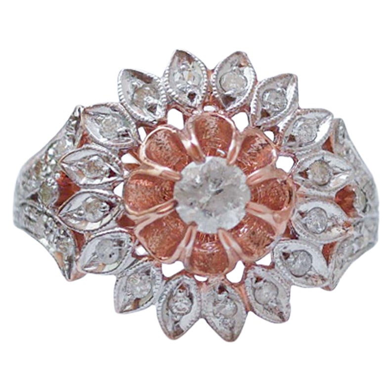 Anello con diamanti, oro rosa e argento.