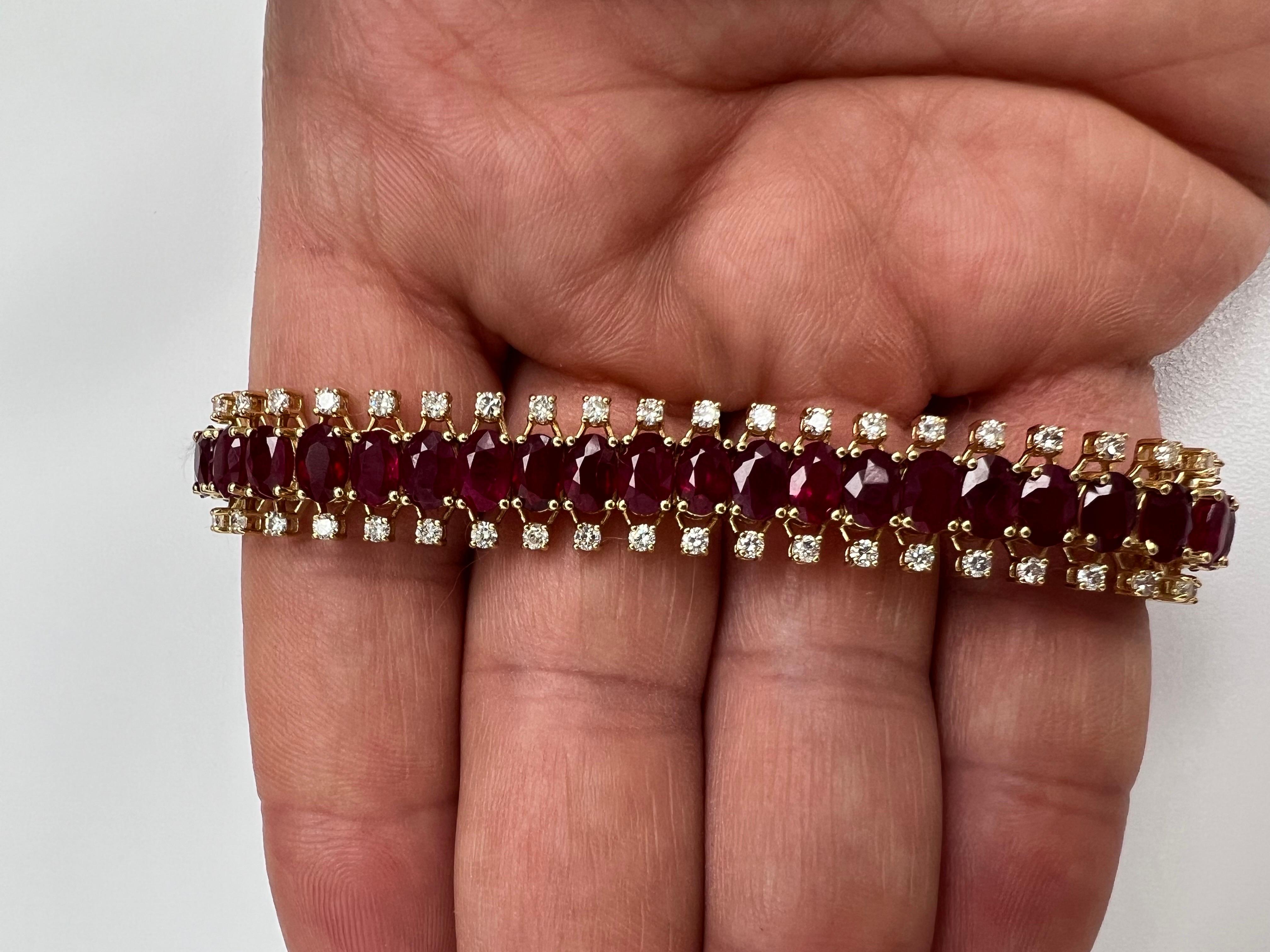 Indulge in the mesmerizing allure of this extraordinary bracelet, a true testament to opulence and refinement. Crafted with utmost artistry, this masterpiece showcases a stunning fusion of unique diamonds and radiant rubies, elegantly encased in 18k