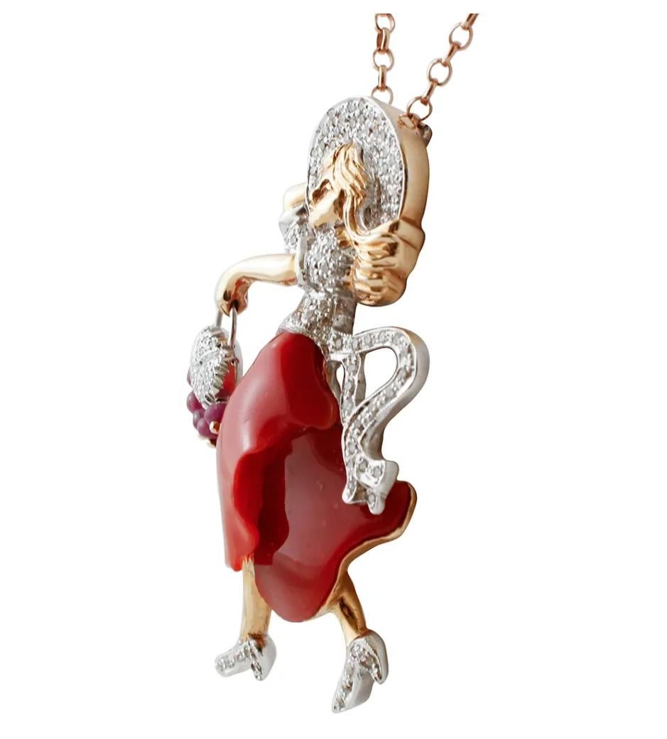 Pendant in 14k white and rose gold structure, with lady design, realized with an oxblood coral dress and decoration of diamonds and rubies .
This particular pendant was totally handmade by Italian master goldsmiths.
The chain is not