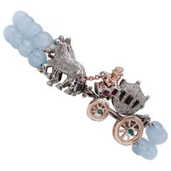 Bracelet en or et argent 9 carats avec diamants, rubis, émeraudes, saphirs et aigue-marines