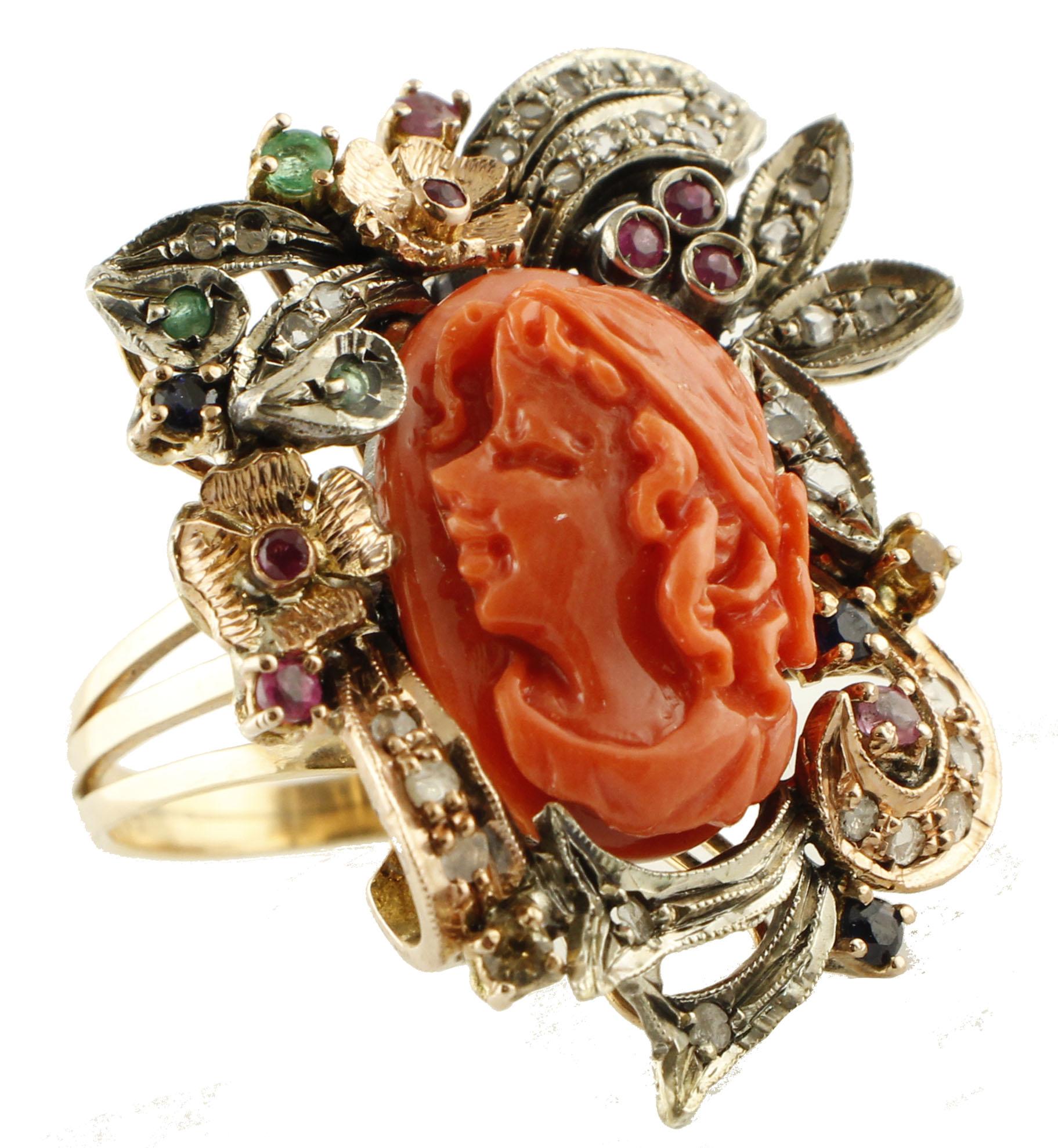 Amazing retrò ring in 9K rose gold and silver structure mounted with 2 g of engraved face coral button in the center surrounded by 9K rose gold and silver detailes studded by 0.35 ct of little rose cut diamonds and  adorned with 0.85 ct of little