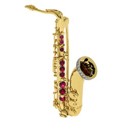 Diamonds Rubies Saxophone 18 karat Yellow Gold Brooch