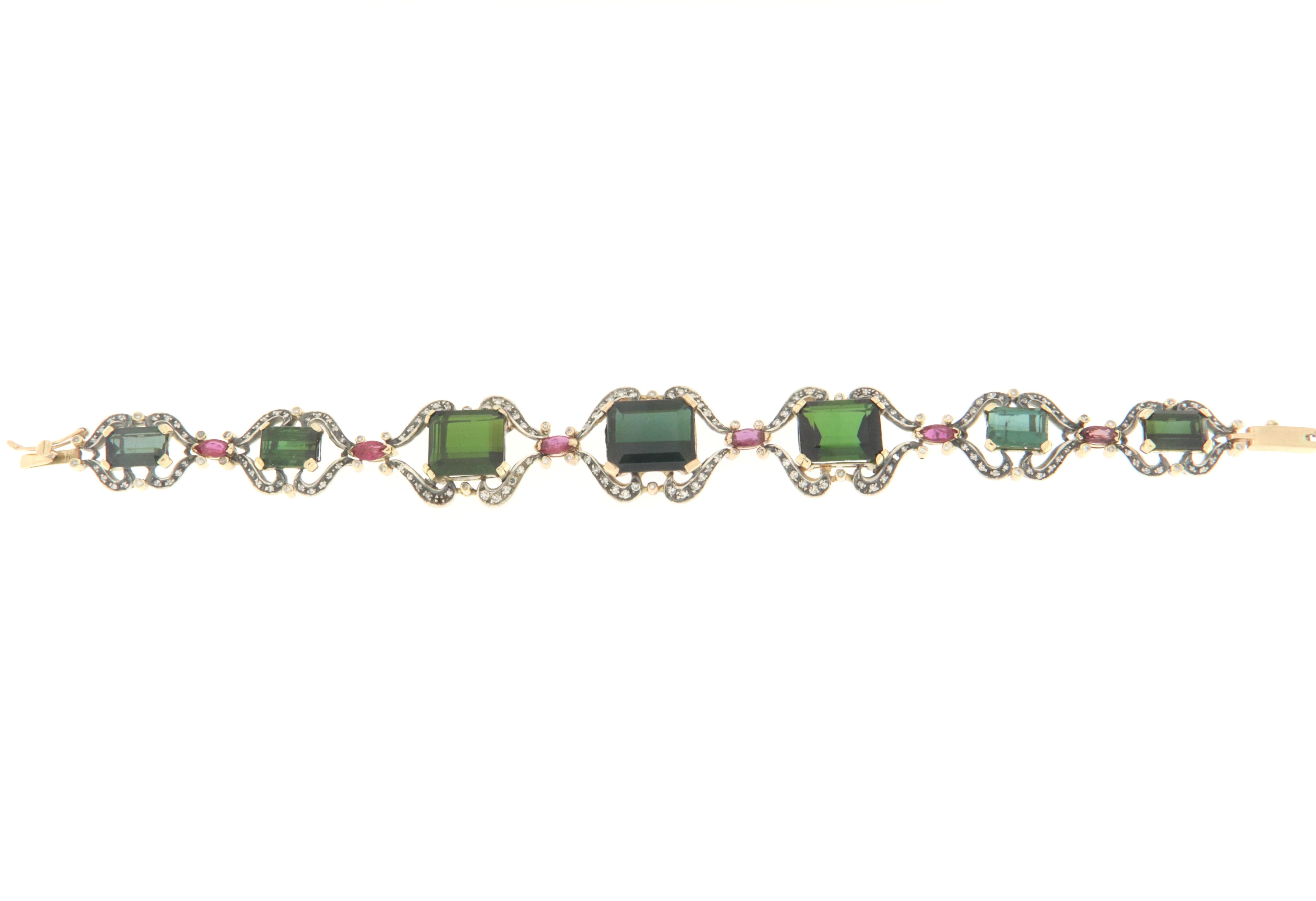 Fantastic 14 karat white gold and 800 thousandths silver cuff bracelet.Handmade by our artisans assembled with green tourmaline,shuttles ruby and diamonds

Bracelet weight 25.90 grams
Diamonds weight 1.07 karat
Tourmaline weight 31.3 karat
Rubies