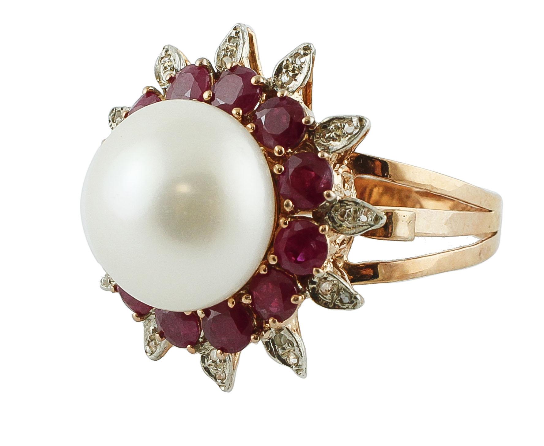 Amazing cluster flower theme ring in 9K rose gold and silver structure mounted with a glossy white pearl in the center (2.60 g) surrounded by 3.25 ct of intense color rubies crown, and it's adorned by leaves detailes studded by 0.11 ct of little