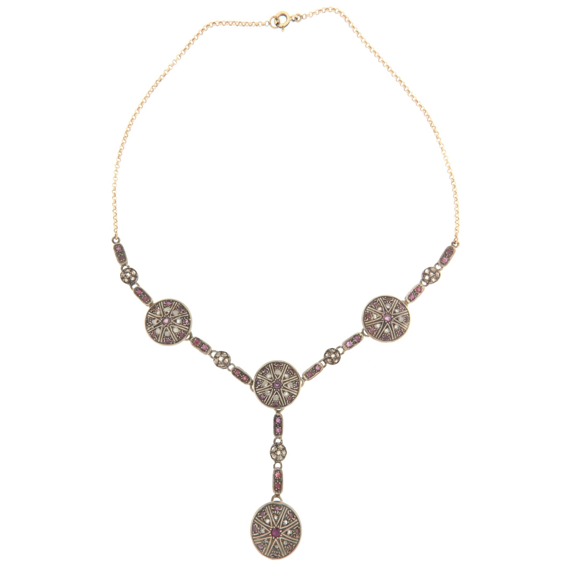 Collana con diamanti e rubini in oro giallo e argento 14 carati