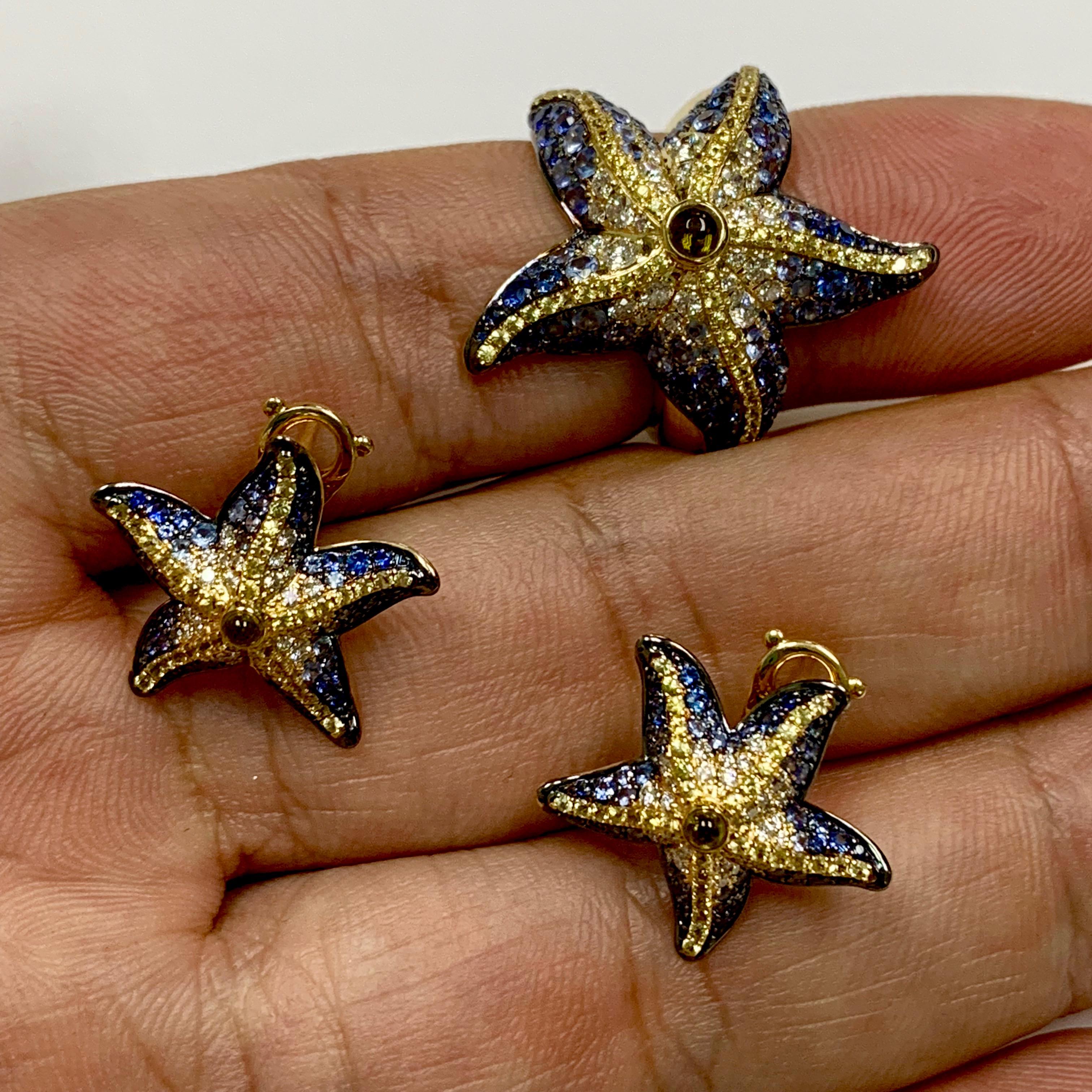 Diamonds Sapphire 18 Karat Yellow Gold Sea Star Ring Earrings Suite

Dream on Sunny Sea Holidays? With this Sea Star Ring all the colours of the reef will be always with you.
Check the graduation of the colours, and how the shape of the Sea Star fit