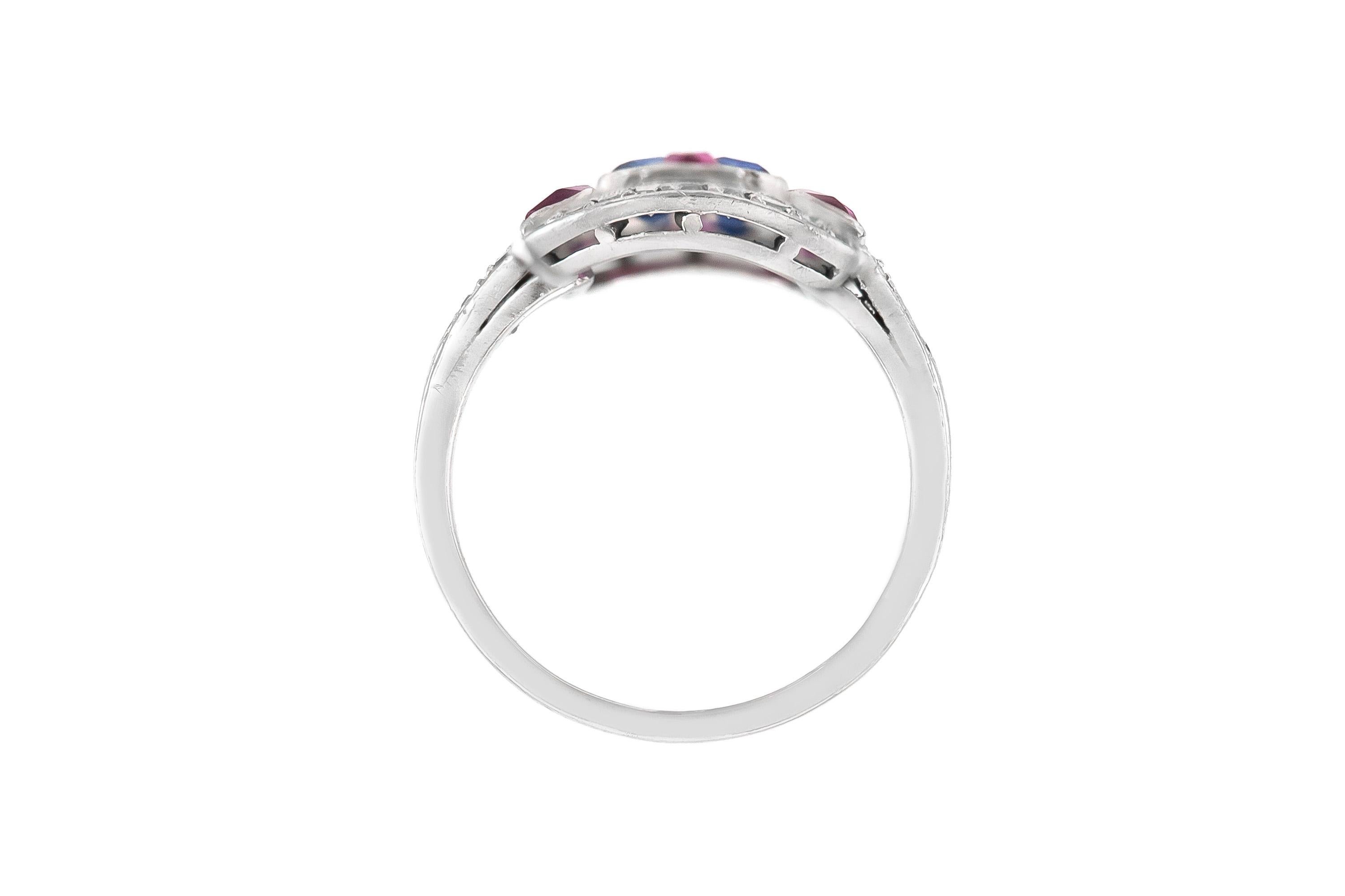 The ring is finely crafted in platinum with diamonds weighing approximately total of 1.00 carat ,ruby weughung approximately total of 1.20 carat and sapphire weighing approximately total of 1.00
Circa 1950
Size 6.45 (easy to resize )