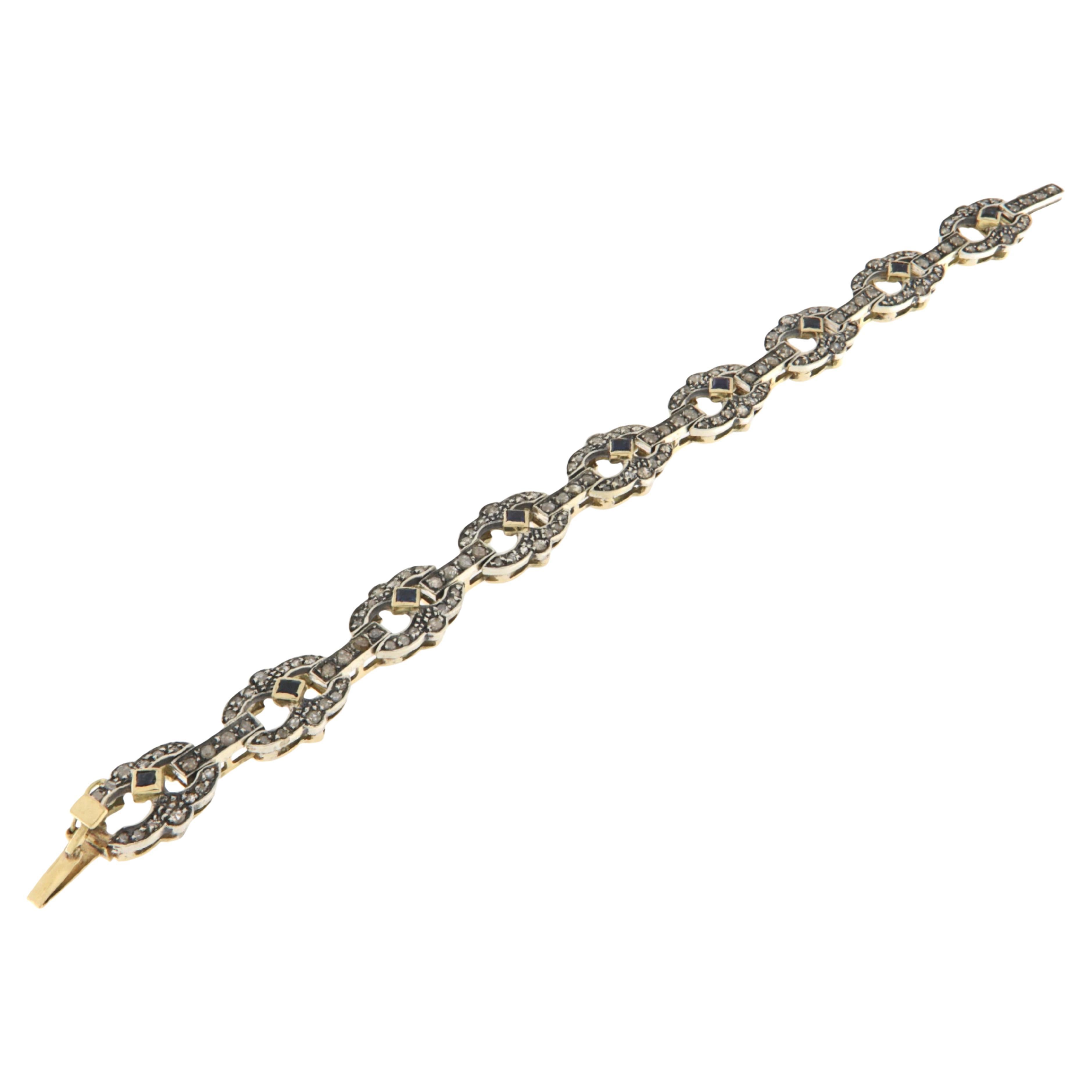 Bracciale in oro giallo 14 carati con diamanti e zaffiri in vendita