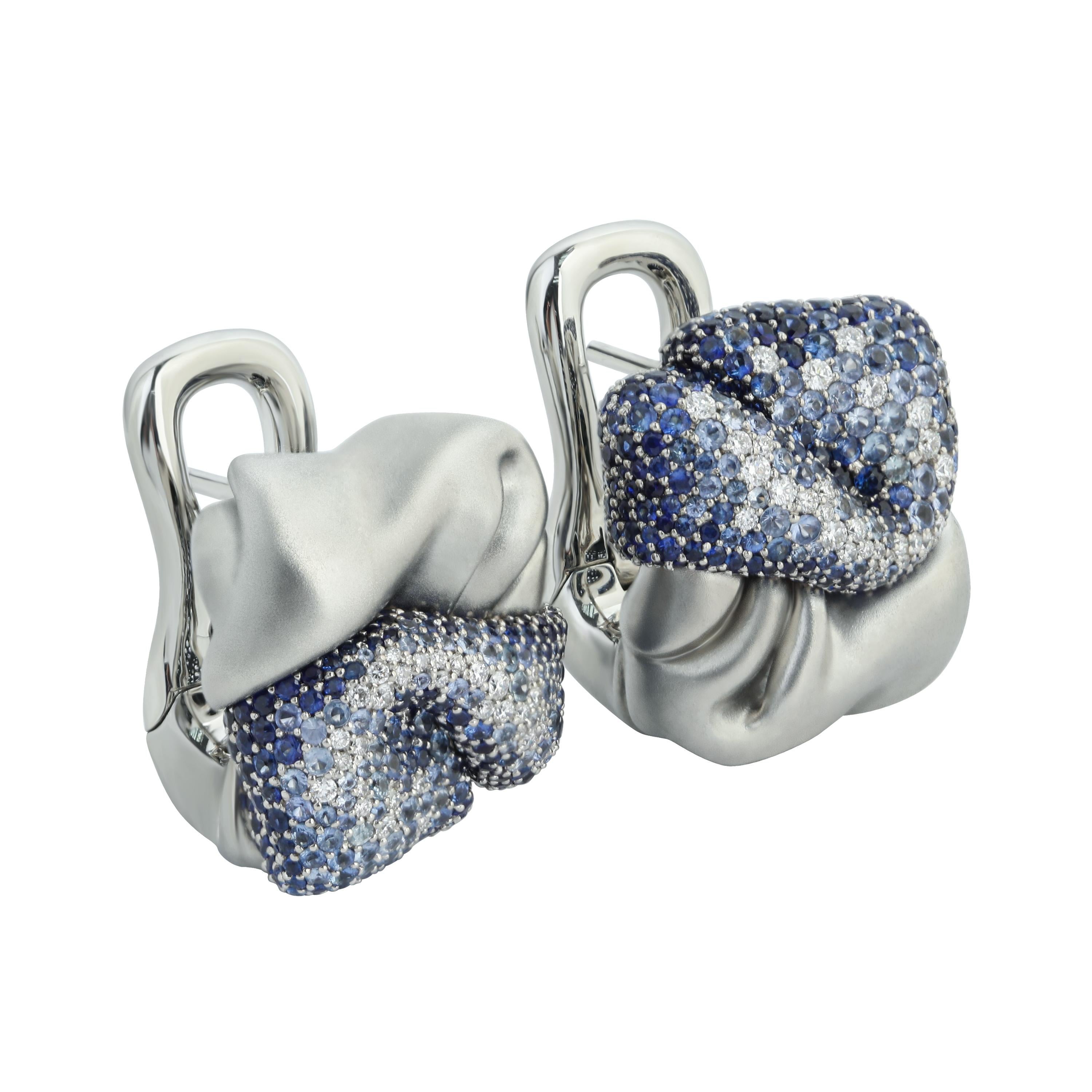 Diamonds Sapphires 18 Karat White Gold Earrings
Our Pre-a-Porter collection is full of different textures and patterns. This time we decided to depict just a piece of crumpled fabric in the Earrings. One part of the Earring is made of 18 Karat Matte