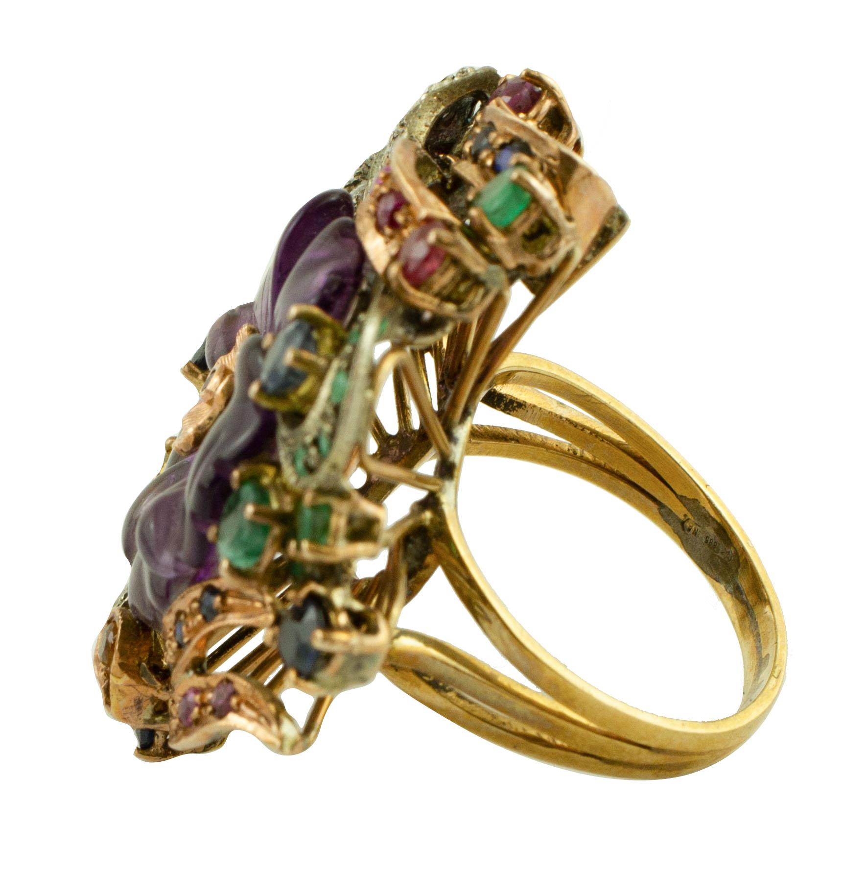 Amazing ring in 9k rose gold and silver, embellished with a central amethyst, surrounded by leaves studded with diamonds, emeralds, sapphires and rubies.
Diamonds 0.36 ct
Emeralds Sapphires Rubies 3.44 ct
Amethyst 1.80 gr
Total weight 13.4 gr
This