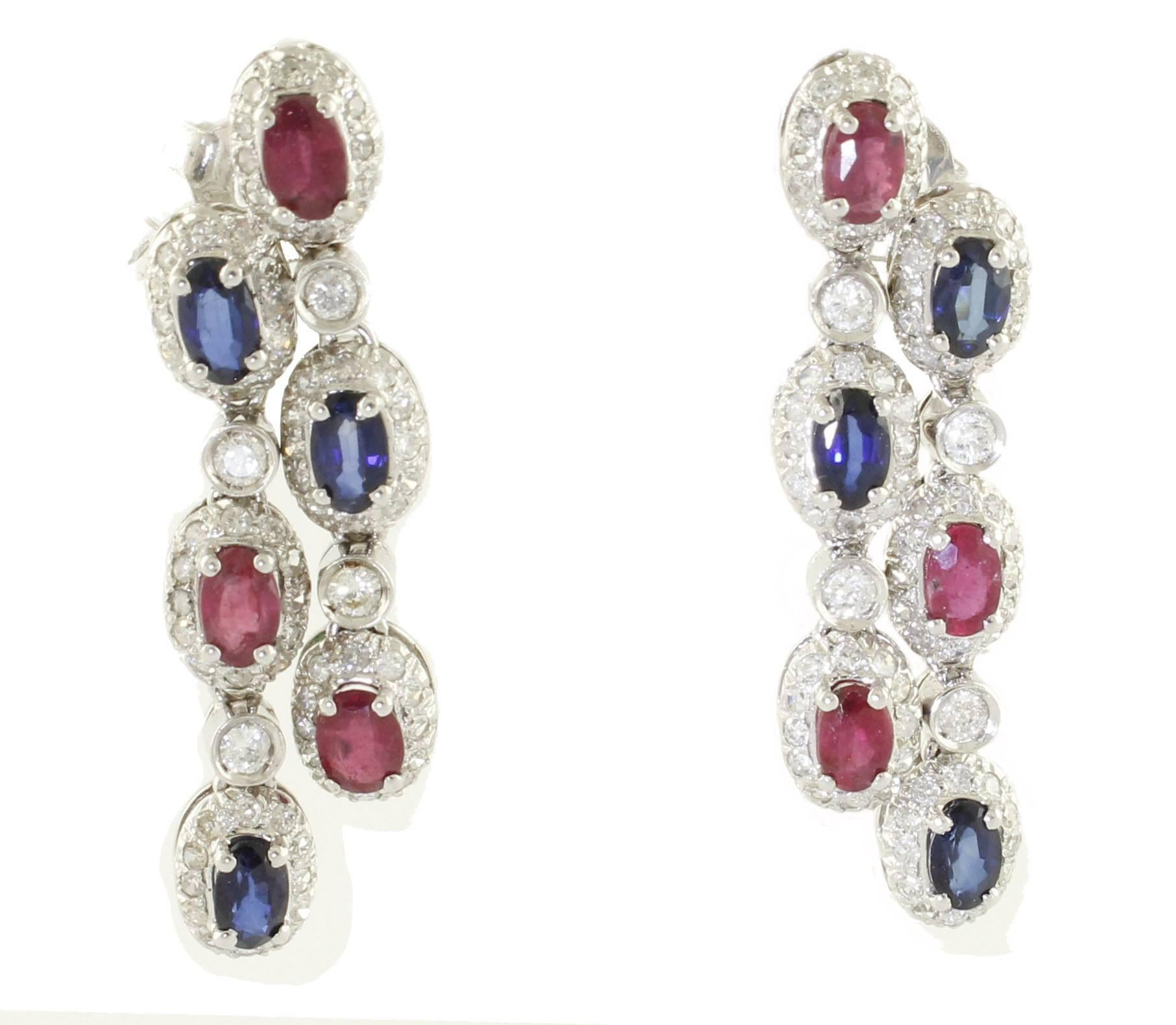 Fantastic 14 kt white gold dangle earrings, studded with rubies and sapphires from ct 4.23, and surrounded by 1.82 ct diamonds. Total weight g 8.20.
Diamonds ct 1.82
Rubies, Sapphires ct 4.23
Total weight g 8.20
R.F + ouir

For any enquires, please