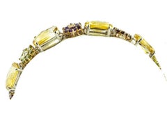 Armband aus 14 Karat Gold mit Diamanten, Saphiren, Topas, Amethysten, Granat, Peridot