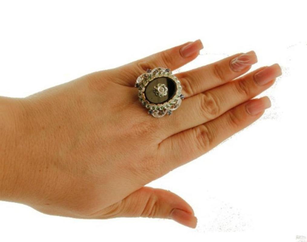 Mixed Cut Diamonds, Sapphires, Tsavorite, Onyx, 14 Karat White and Rose Gold Vintage Ring For Sale