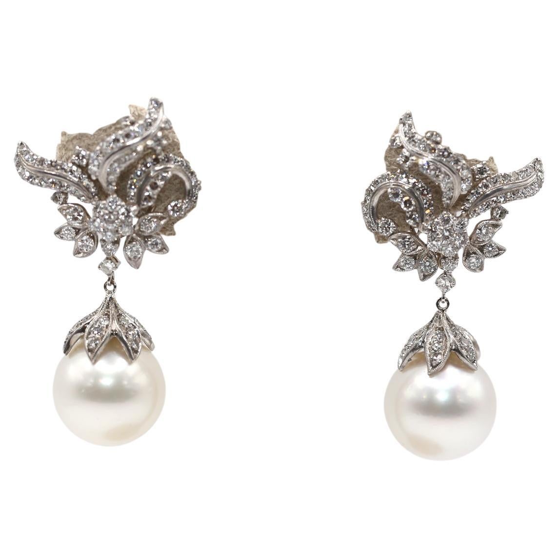 Fine Diamonds & South Sea Pearls Day and Night Transformer Earrings. Created around 1970.

3.52 Carats of white Diamonds. Luxurious and impressive 18K White Gold earrings studded with white Diamonds and white Pearls, The unique design of earrings