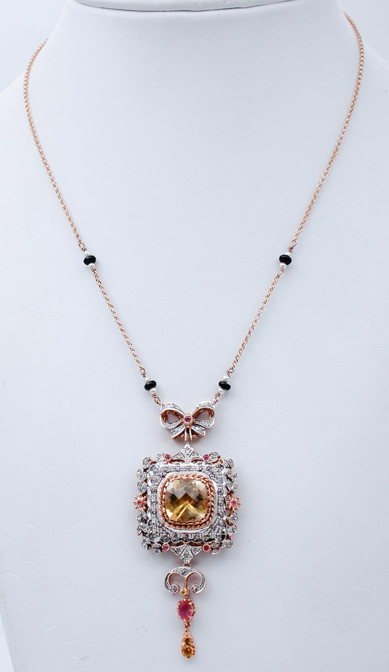 Beautiful retrò necklace in 9 karat rose gold and silver necklace mounted with a central topaz surrounded by diamonds and rubies. As pendant, a ruby and two topazs. Along the chain, little pearls and onyx.
This necklace was totally handmade by