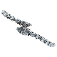 Diamanti, topazi, tsavorite, bracciale a serpente in oro rosa e argento