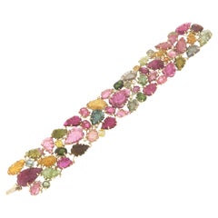 Bracelet manchette en or jaune 14 carats, diamants, tourmalines et saphirs