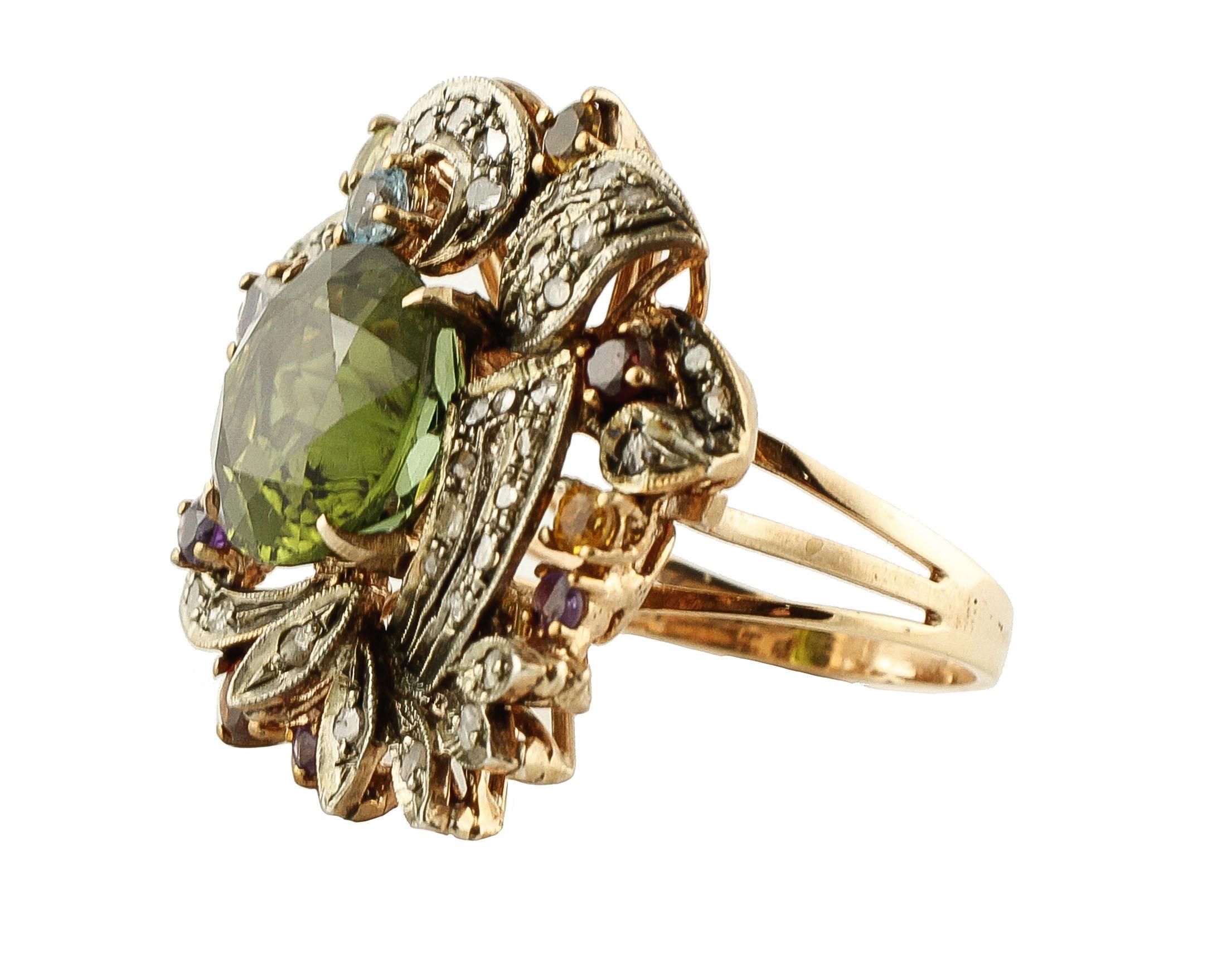 Fabulous cluster ring in 9K rose gold and silver ring mounted with deep color green tourmaline (12 mm X 12 mm) in the center surrounded by leaves detailes studded by little rose cut diamonds, and adorned with yellow and light blue topazes, pink