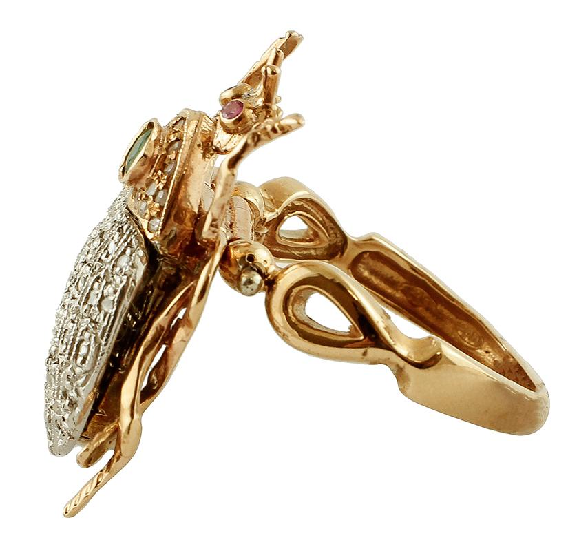 Amazing fashion retrò ring with movable ladybug shape mounted in 9 kt rose gold and silver.
It is composed of two little rubies like eyes and one emerald on the neck. All the neck and the wings are studded with diamonds. In addition, the rest of the
