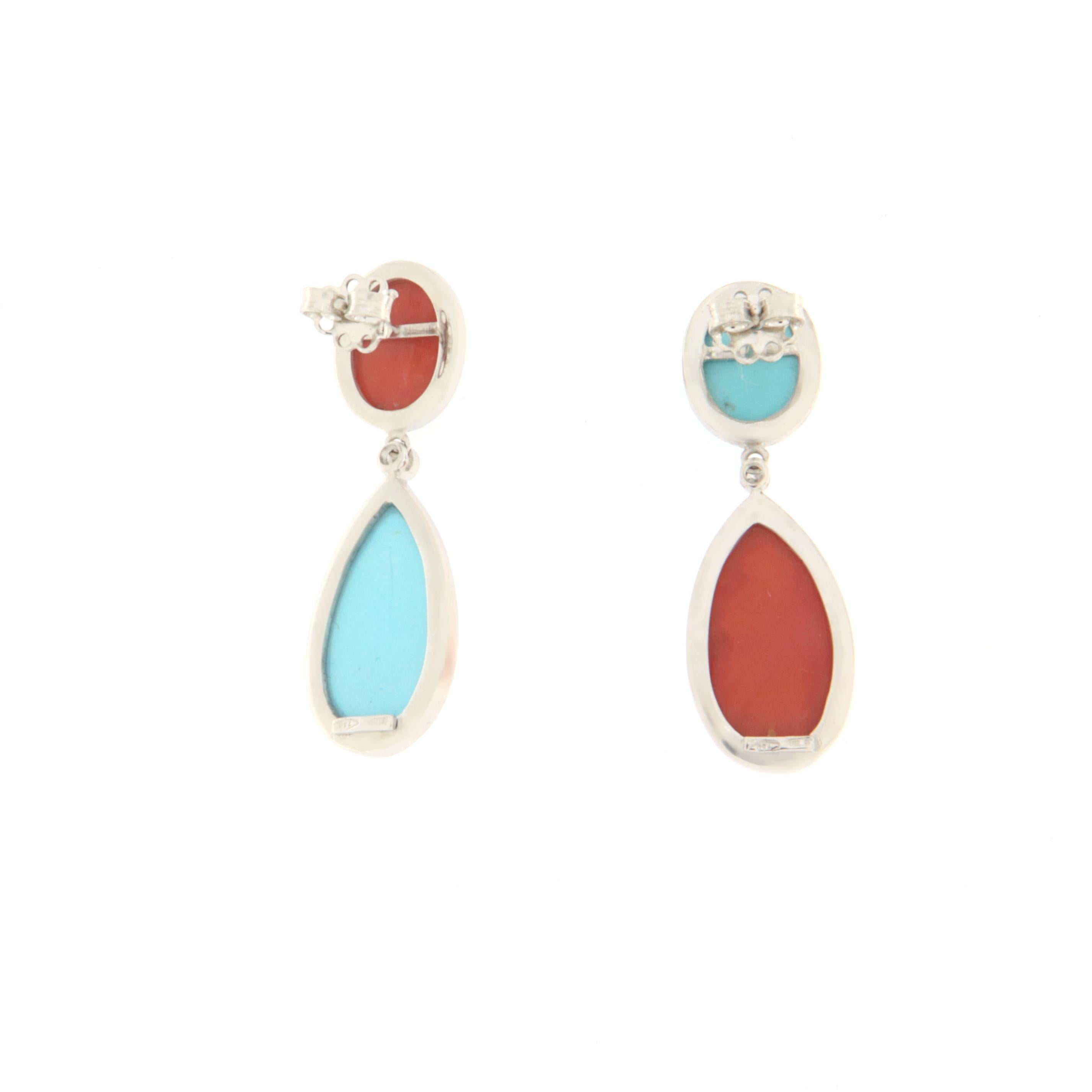 Fantastic earrings made entirely by hand by expert master craftsmen. Made of 18 Karat white gold with natural diamonds coral and turquoise.

Total Weight earrings 13.90 grams
Diamonds Karat 0.04
Coral weight 3.40 grams
Turquoise weight 2.80 grams



