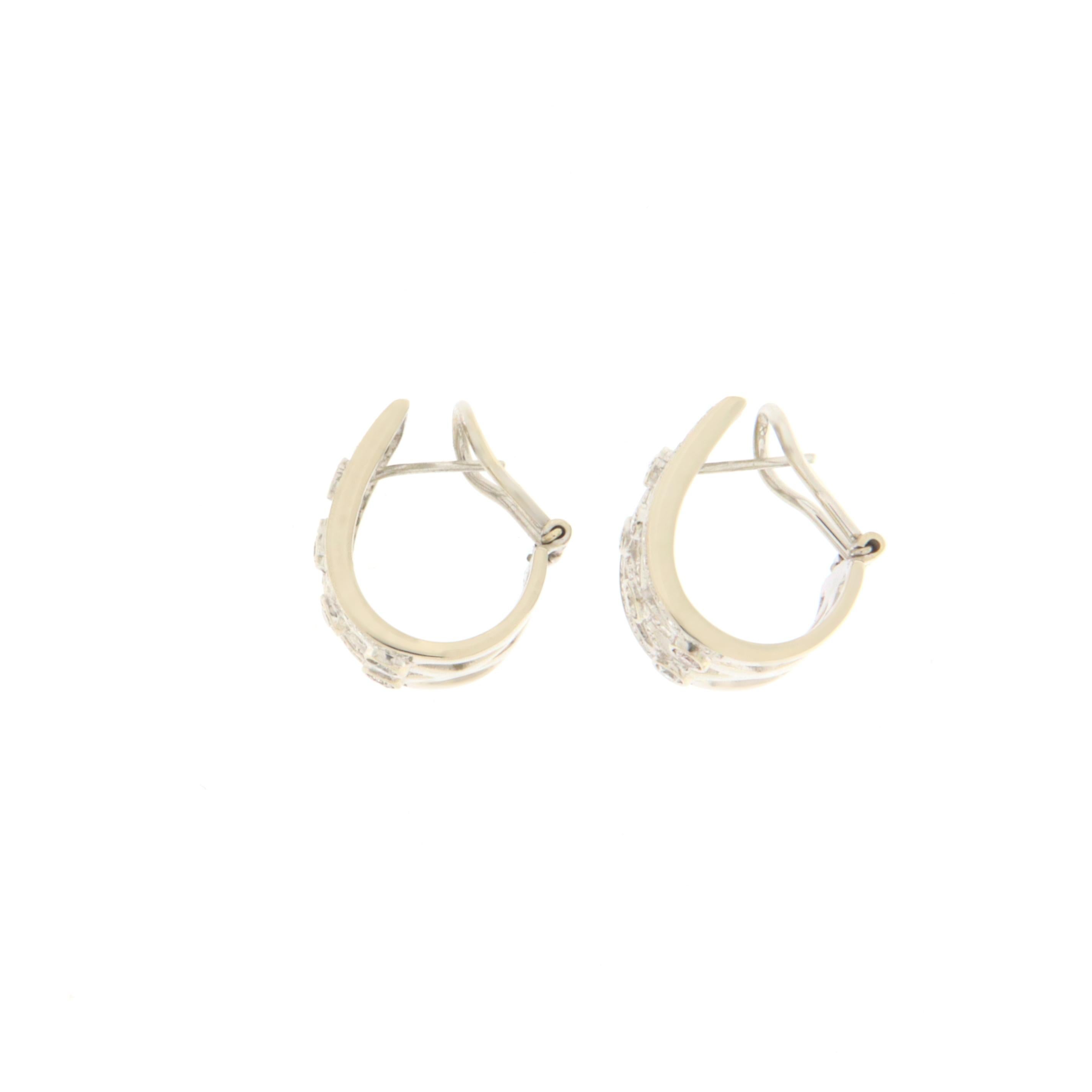 Delicious stud earring made entirely by hand.  On the earrings made of 18K white gold there are natural diamonds of different sizes.
A delicate and easily exhibited earring on any occasion that showcases the beauty of every woman.

Total weight of