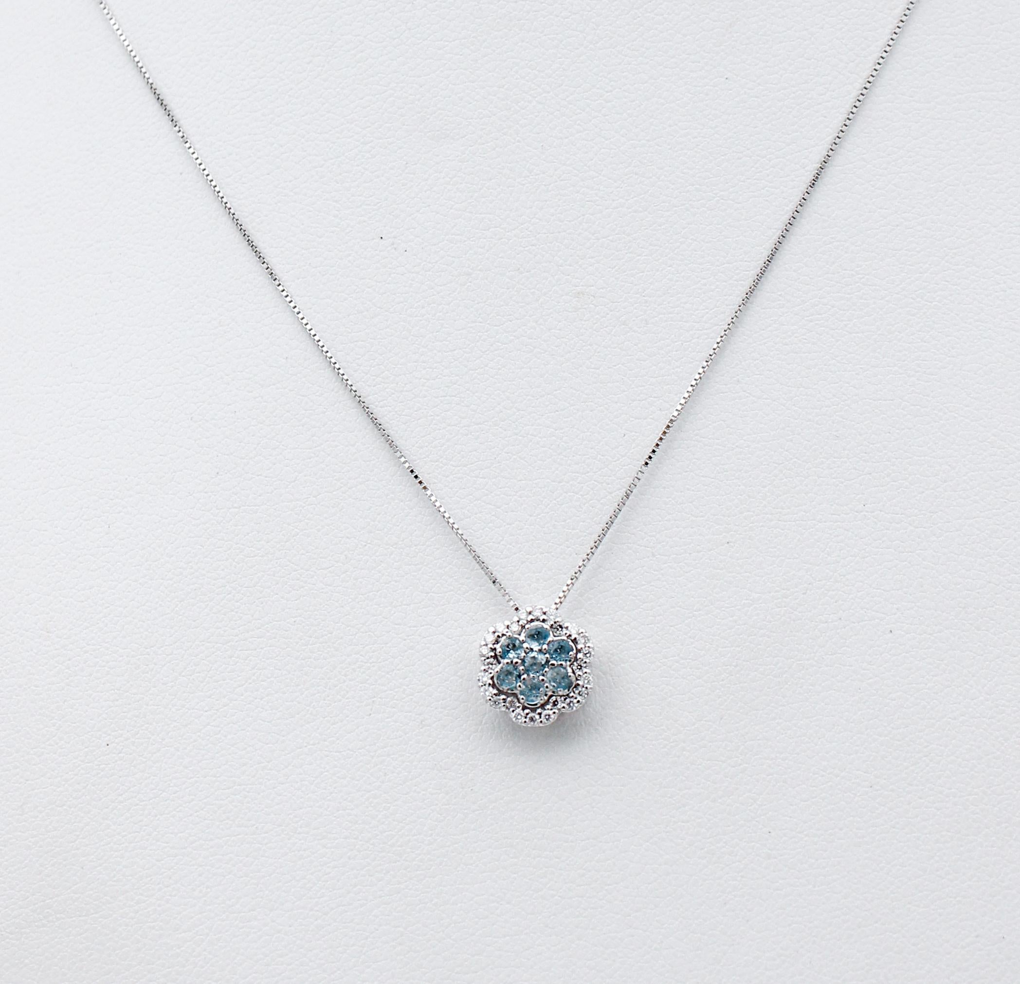 Elegant flower pendant necklace in 18 karat white gold structure studded with seven aquamarine in the central part surrounded by little white diamonds. The chain is included.
Diamonds 0.16 ct
Aquamarine 0.41 ct
Total Weight 2.70 gr
RF 