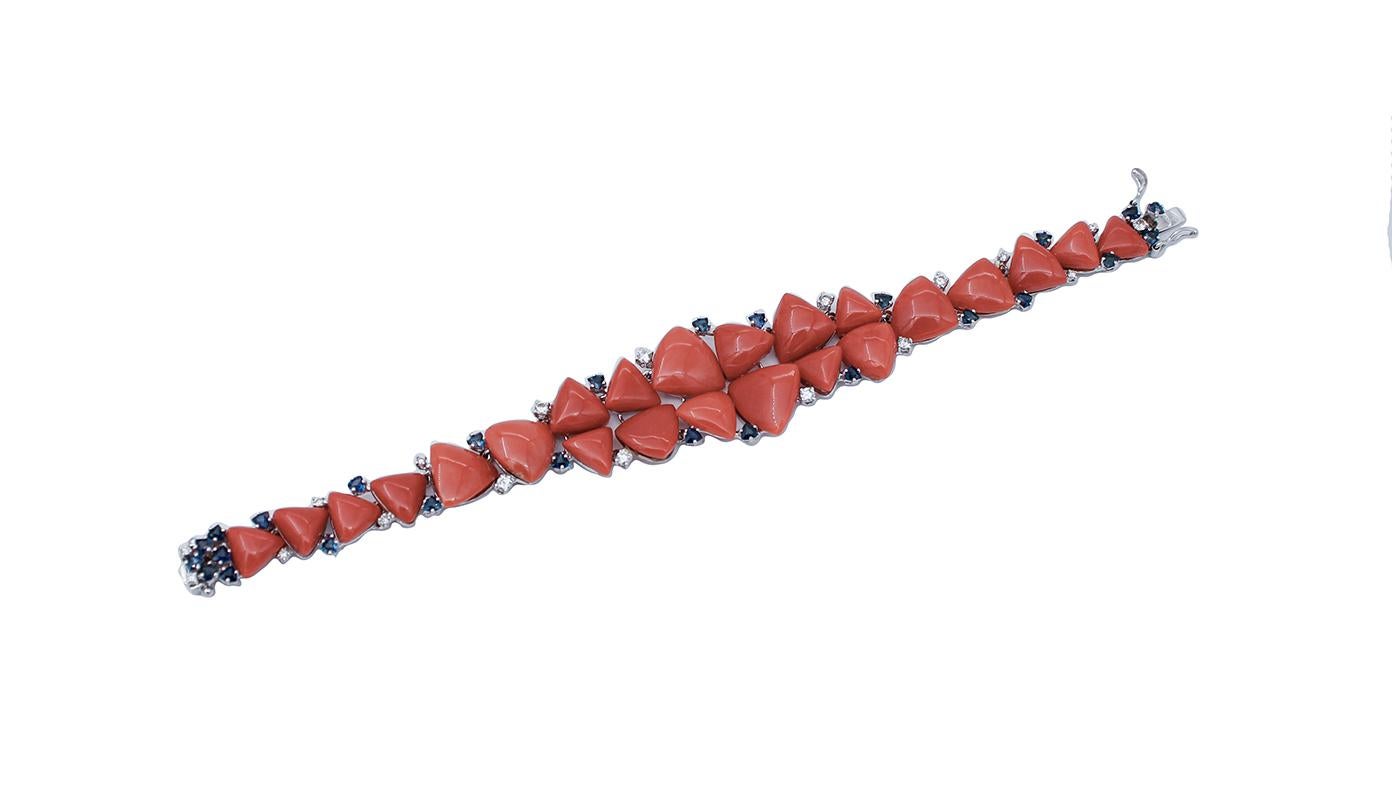 Beautiful bracelet in 14 karat white gold structure mounted with coral surrounded by blue sapphires and diamonds.
This bracelet was totally handmade by Italian master goldsmiths and it is in perfect conditions.
Diamonds 0.78 ct
Blue Sapphires 3.26