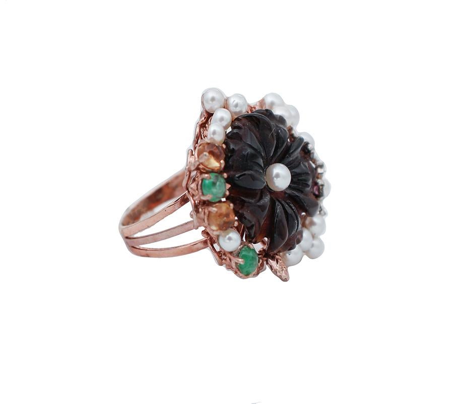 Elegant cocktail ring in 9 karat rose gold and silver structure mounted with a black agate in the central part surrounded by sapphires,emeralds,pearls and diamonds.
This ring is totally handmade by Italian master goldsmiths and it is in perfect