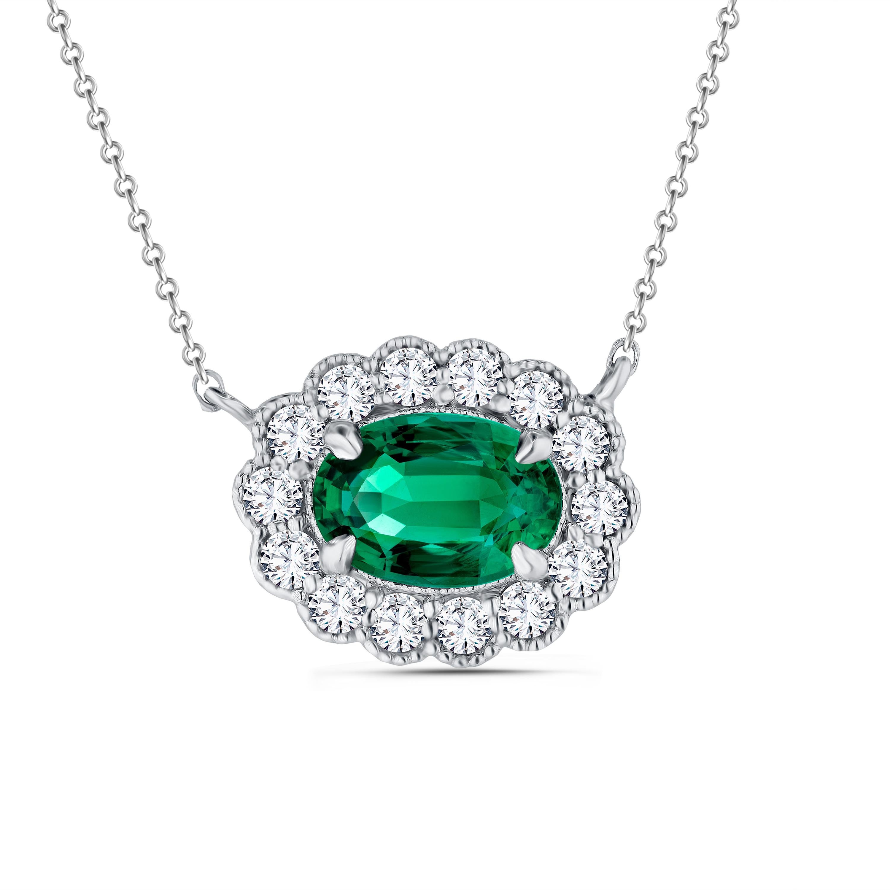Timeless elegance meets modern allure in this beautiful emerald pendant.

At the heart of this masterpiece lies a 1.16 carat oval cut emerald, a gem of unparalleled beauty, exuding a mesmerizing green hue. Enveloping this emerald is a delicate halo