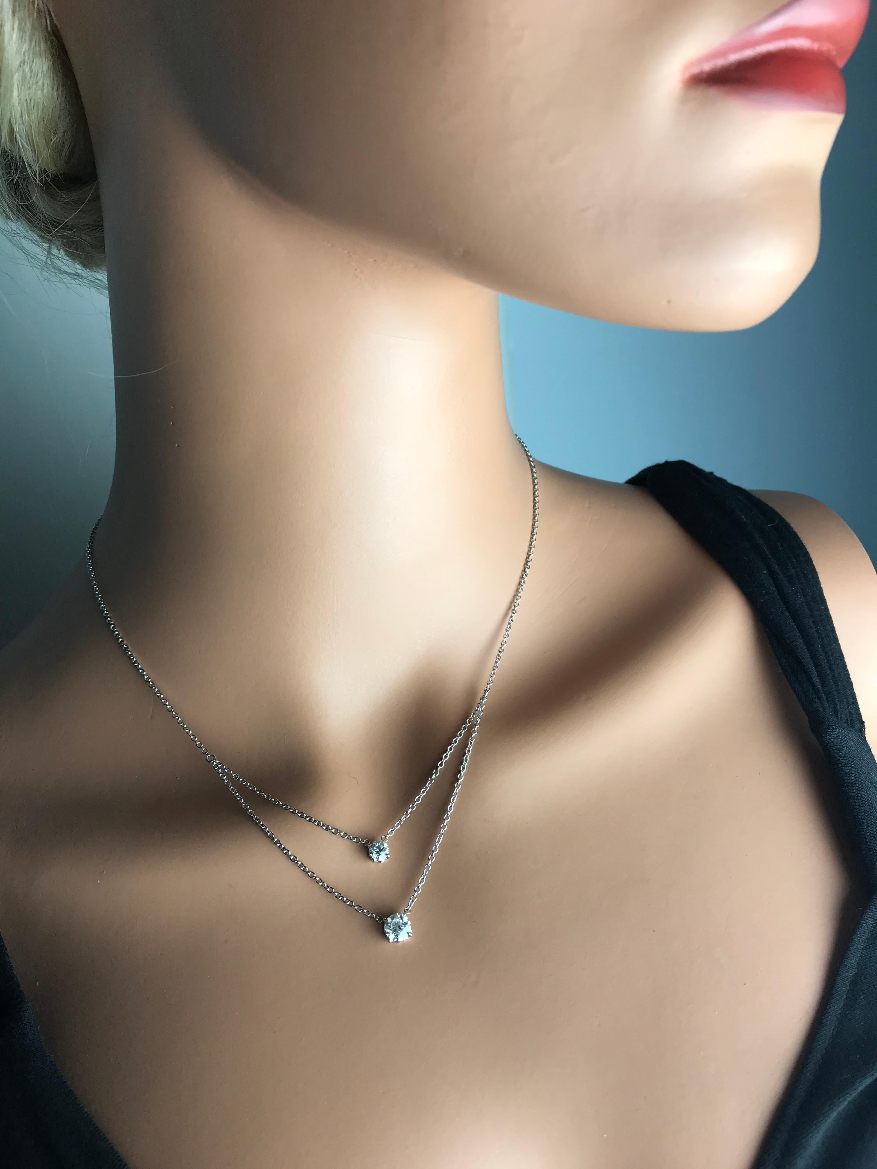 This beautiful diamond drop pendant features two tiers of solitaire diamonds. The larger stone is 0.84 carat, the smaller stone is 0.38 carat. Set in 18k White Gold.

Diamond Town is pleased to offer a variety of Diamond items in all categories.