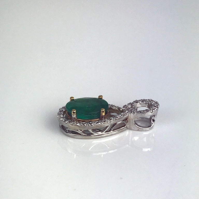 Diamond Town 1.26 Carat Oval Cut Emerald and 0.22 Carat Diamond Pendant In New Condition For Sale In New York, NY