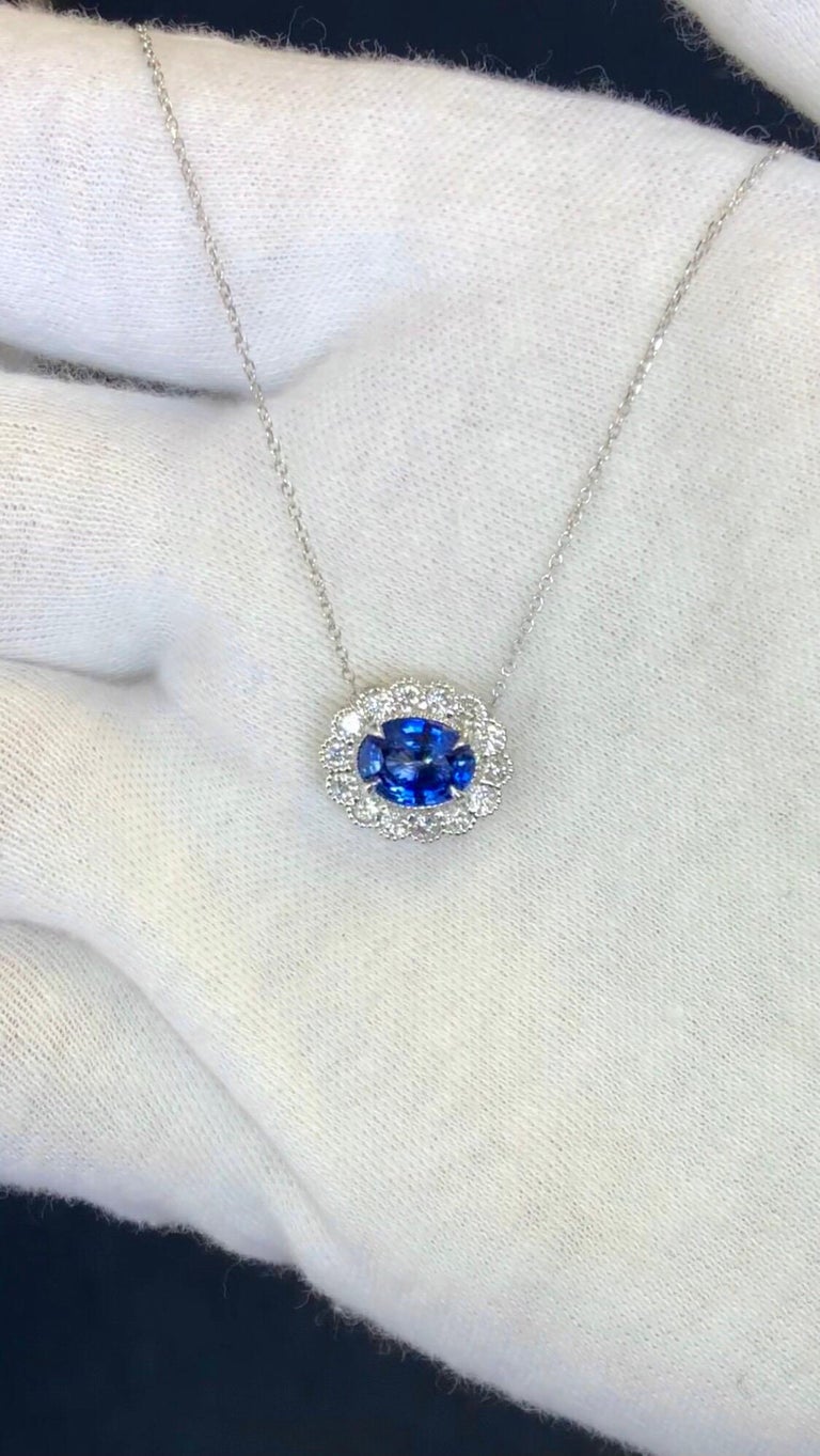 This beautiful pendant has a 1.39 carat oval cut sapphire center, surrounded by a 0.42 carat halo of round white diamonds. Intricate milgrain work in the 18k White Gold setting bring out the old world classic charm of this piece.

Sapphire: 8x6mm