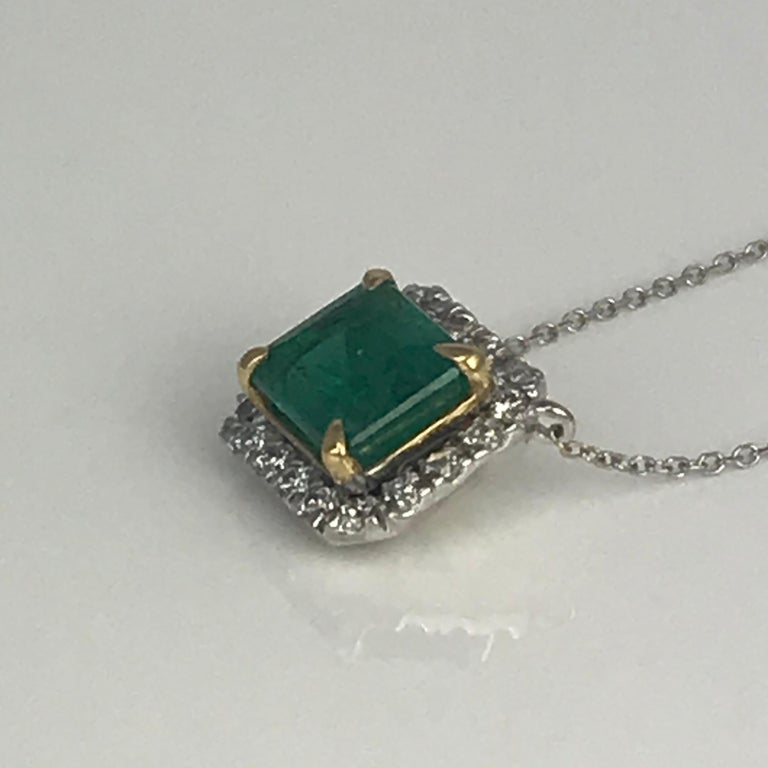 Contemporary Diamond Town 2.33 Carat Emerald Cut Emerald Pendant with 0.32 Carat Diamond Halo For Sale