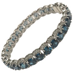 DiamondTown 31.33 Carat Step Cut Blue Topaz and 3.1 Carat White Diamond Bracelet