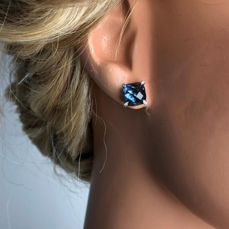 These beautiful earrings feature 7.92 carats cushion cut blue topaz. The prongs are embellished with 0.05 carats diamonds.

Set in 14k white gold, these earrings would be a welcome addition to any jewelry box.

Diamond Town is pleased to offer a